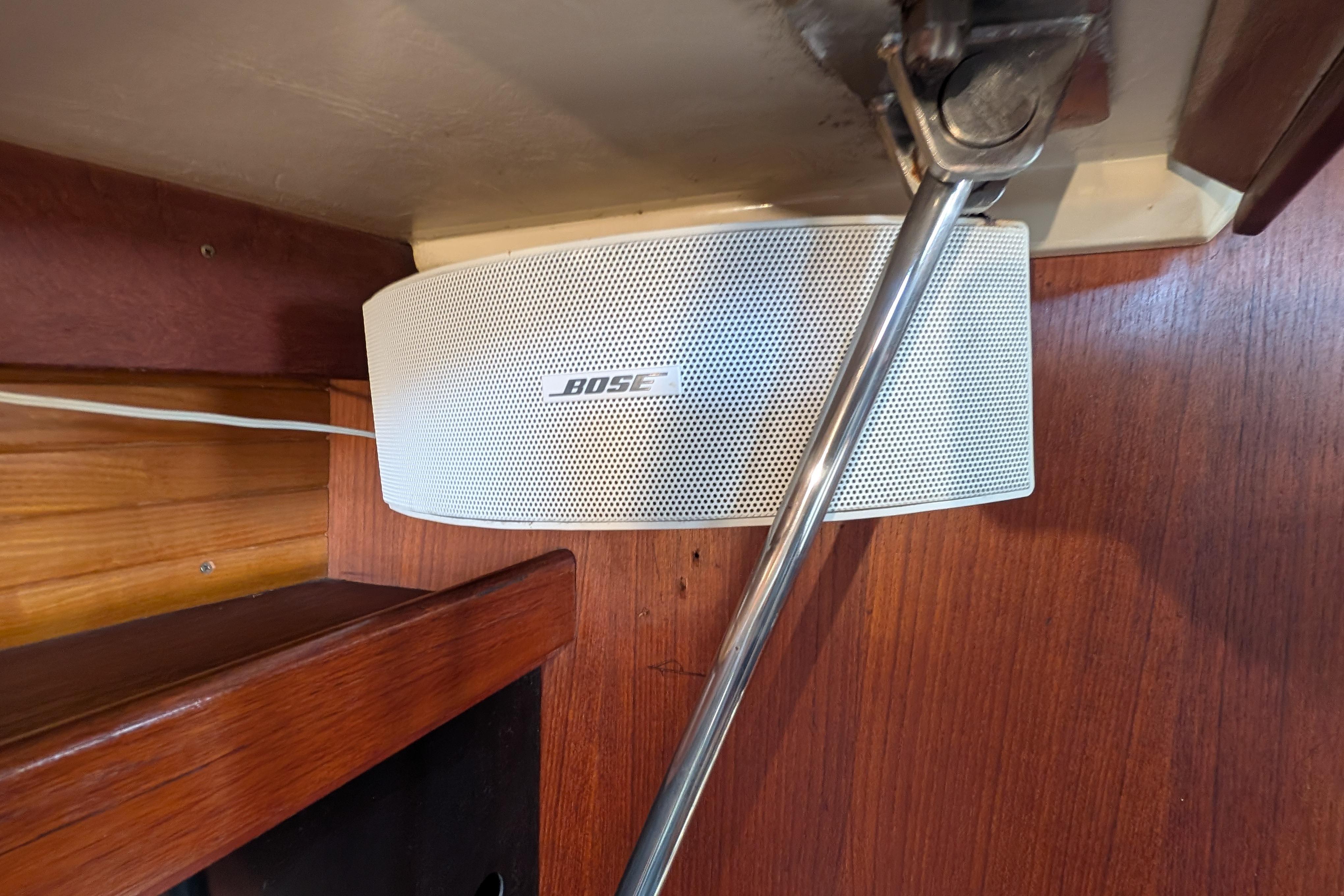 Bose speaker mounted inside a 1989 Catalina 34 sailboat with wooden interior.