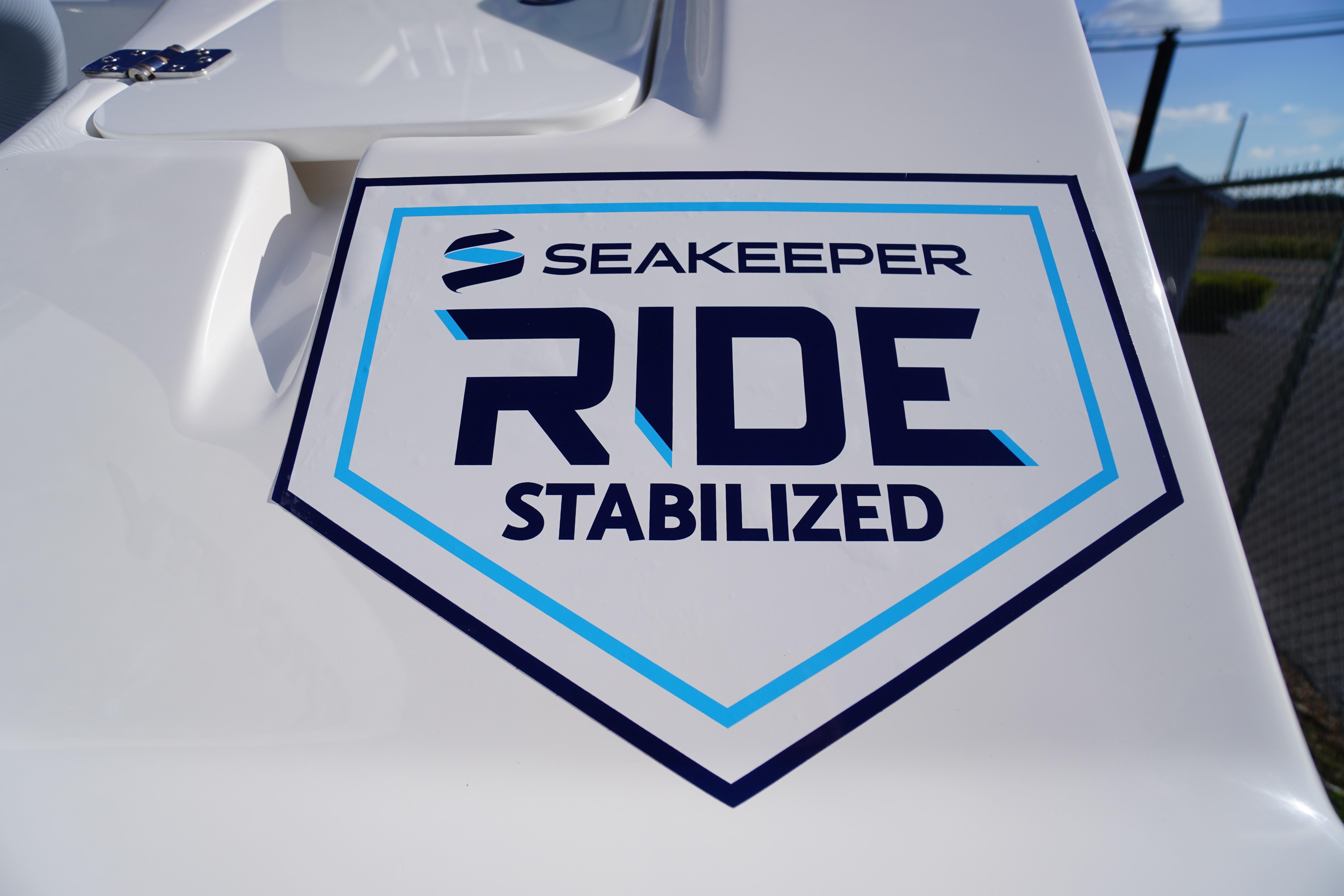2026 Tidewater 272 LXF boat featuring Seakeeper Ride Stabilized technology logo.