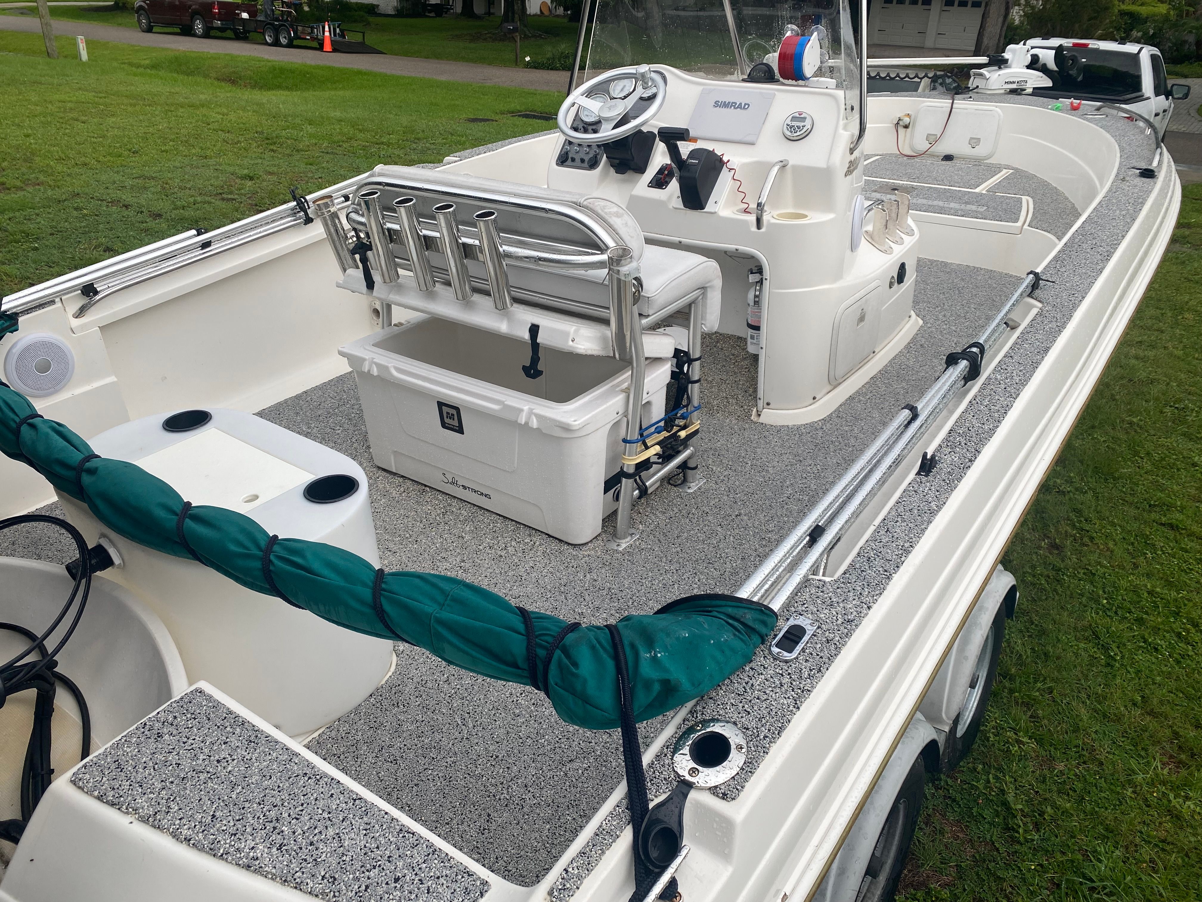 2003 Aquasport 201 Osprey with spacious deck and helm station.