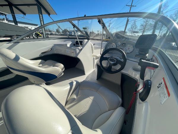 2012 Tahoe Q4 SS boat interior with steering wheel and dashboard controls.