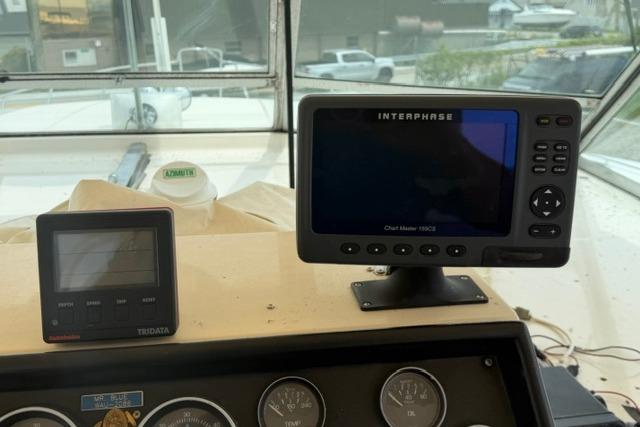 Dashboard of 1980 Chris-Craft 381 Catalina with navigation and monitoring equipment.