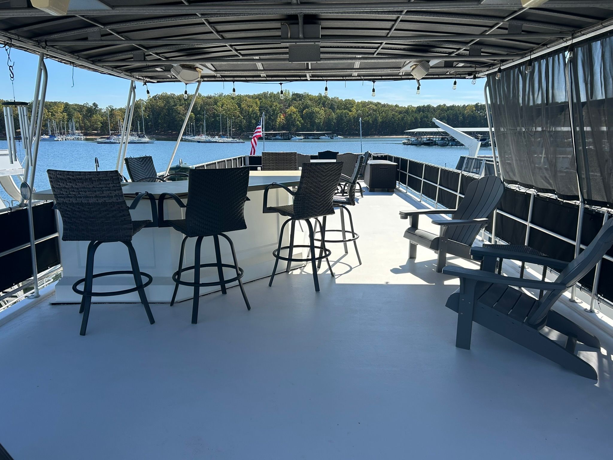 2001 Sumerset houseboat with spacious deck and lake view.