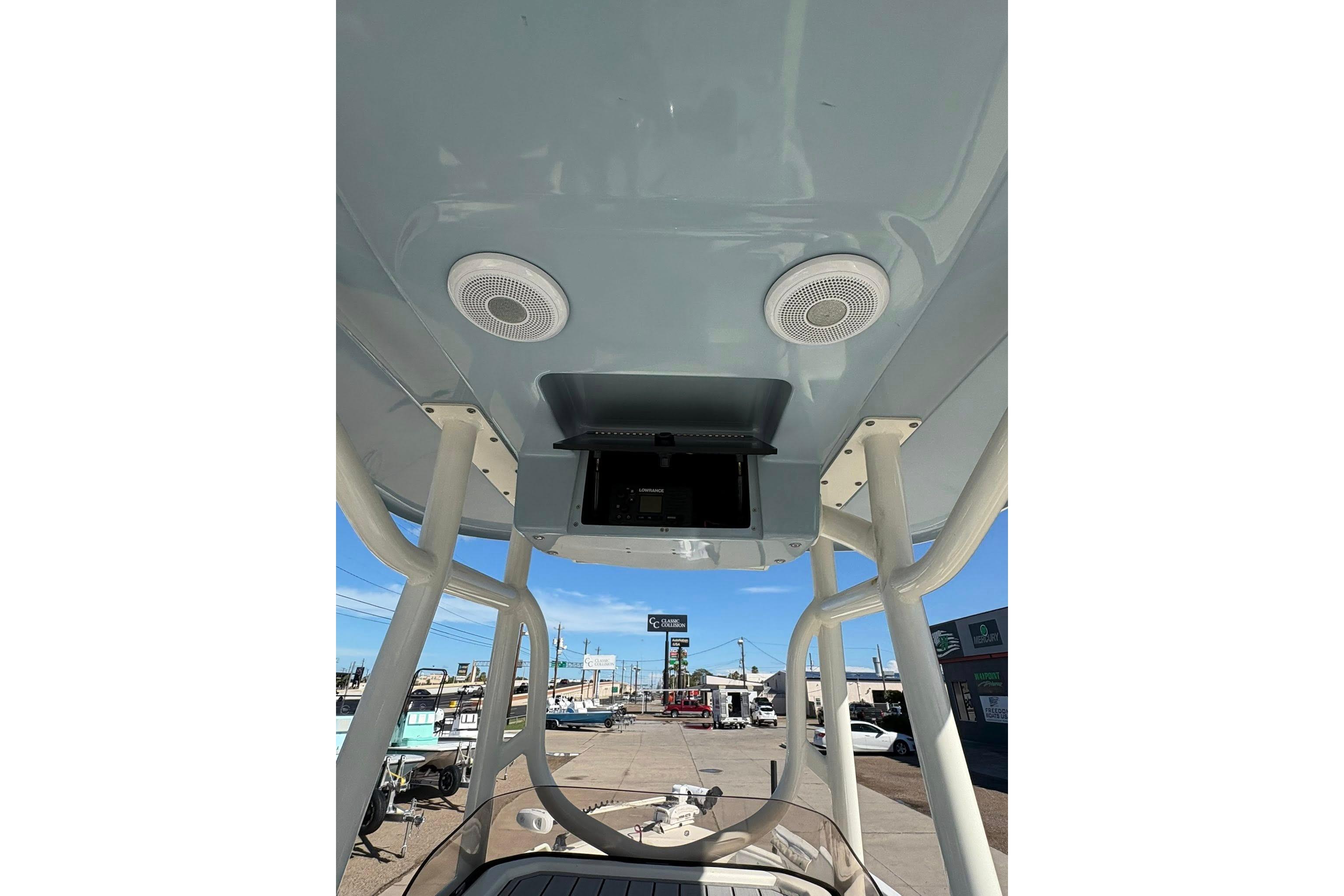 2023 Skeeter SX2550 Family boat interior with speakers and electronics console.