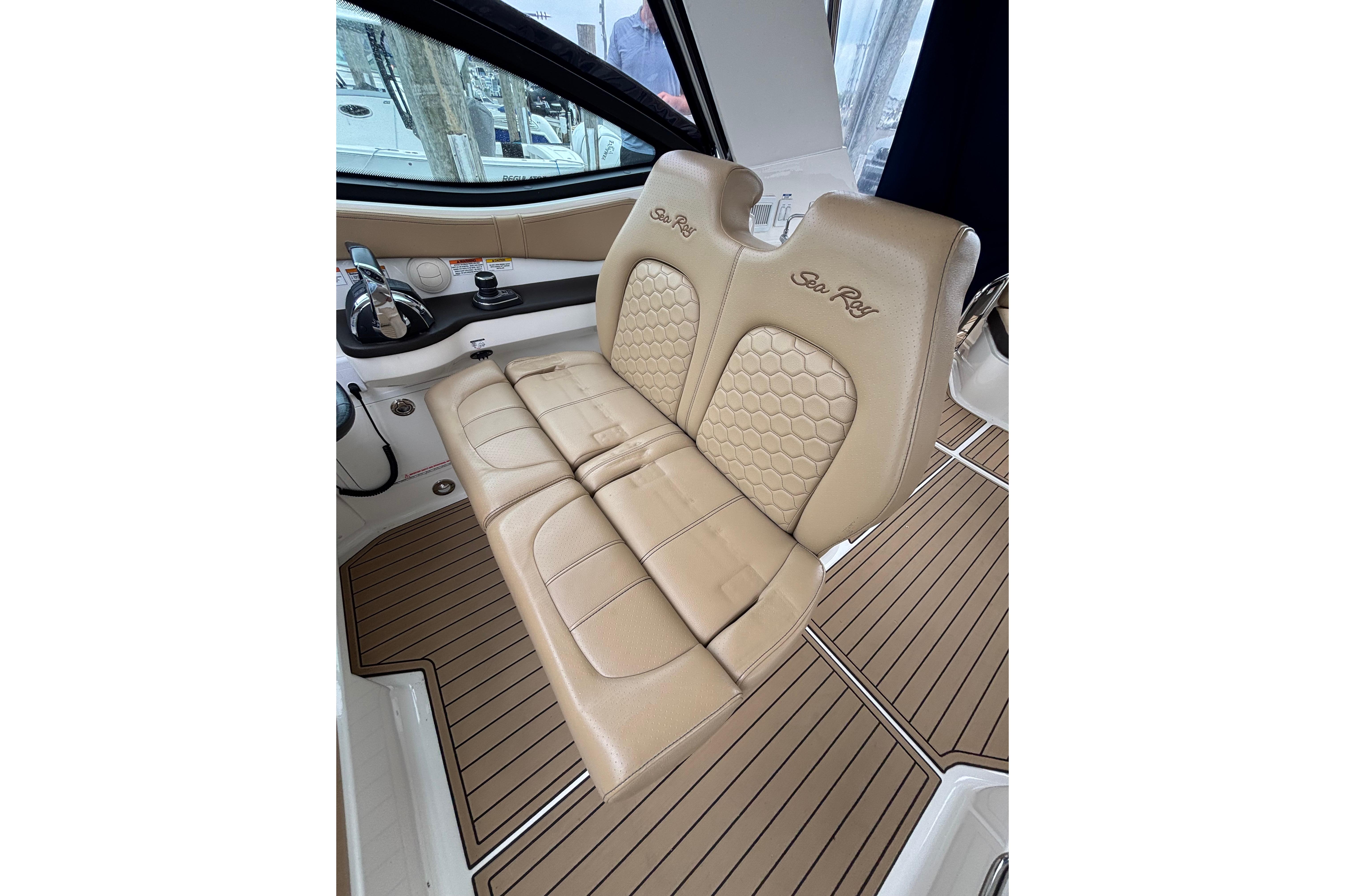 2021 Sea Ray Sundancer 320 Outboard interior with tan leather seating and wood-style flooring.