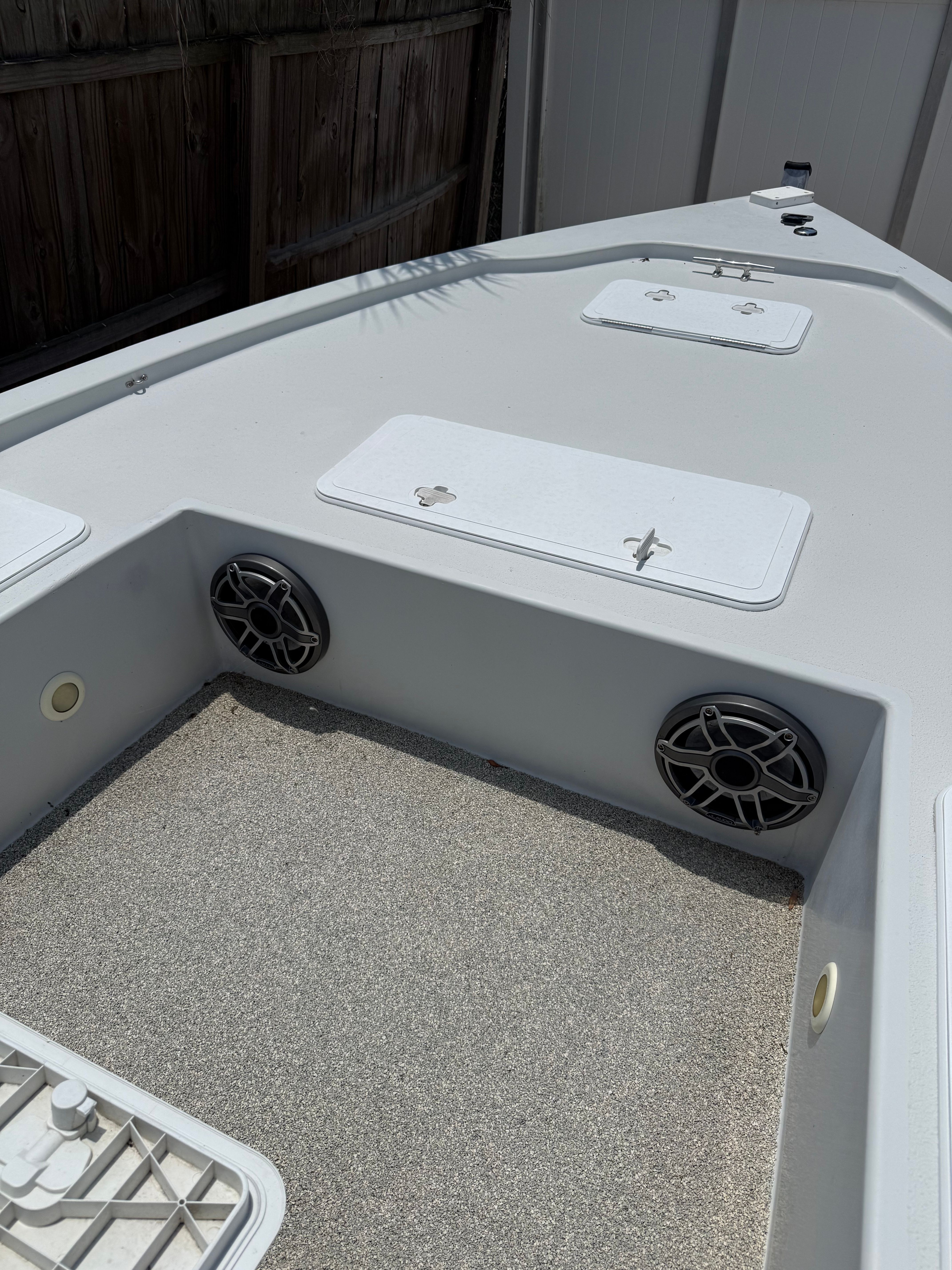 2012 Bay Craft 21 boat with speakers and storage compartments.