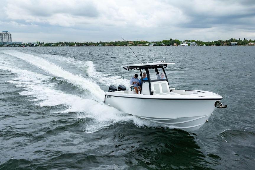 2027 Reef Runner 280 boat cruising on open water under cloudy skies.