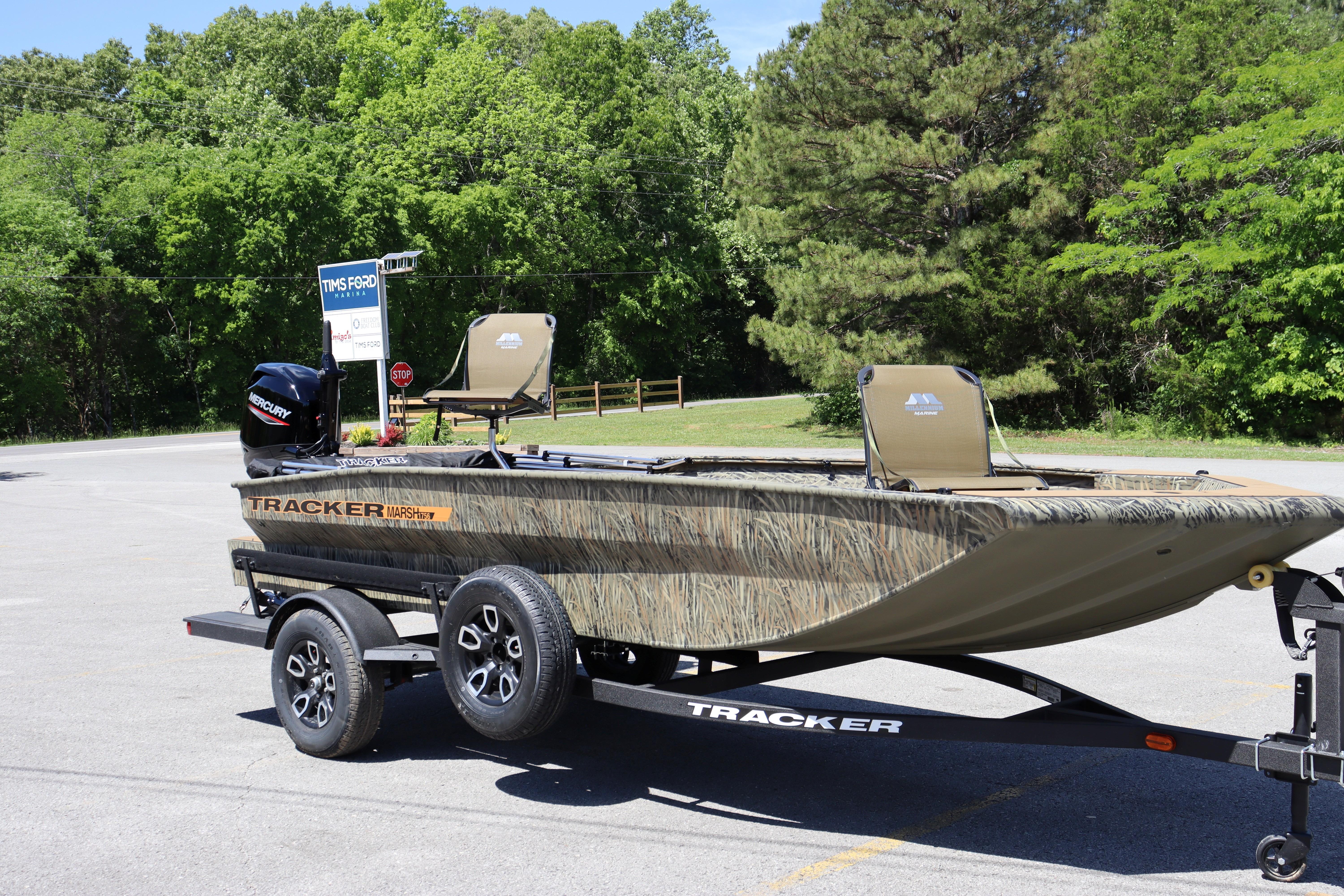 2026 Tracker Grizzly 1756 T Marsh boat on trailer in parking lot.