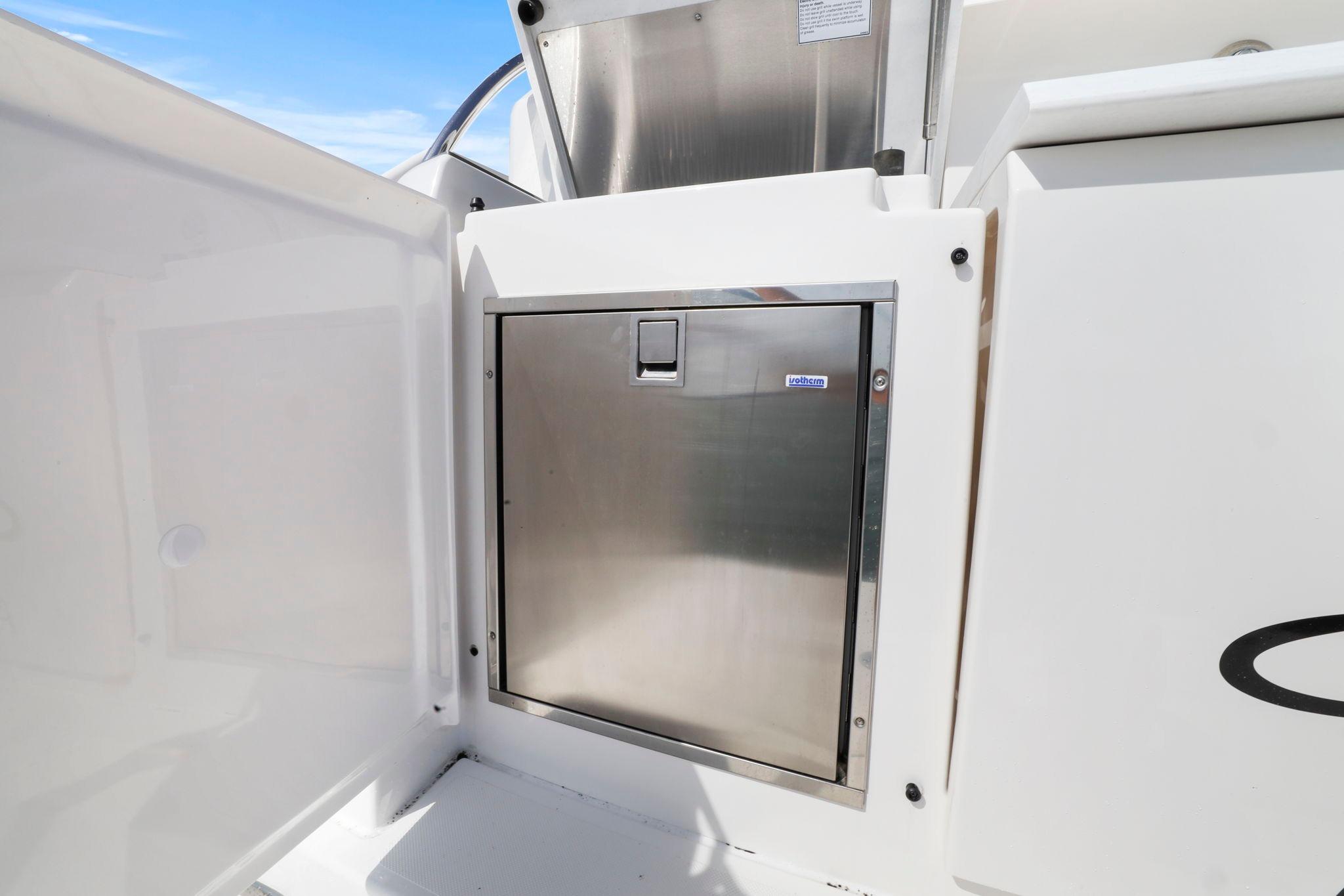 Stainless steel compartment on 2023 Tiara Yachts C49 Coupe, exterior view.