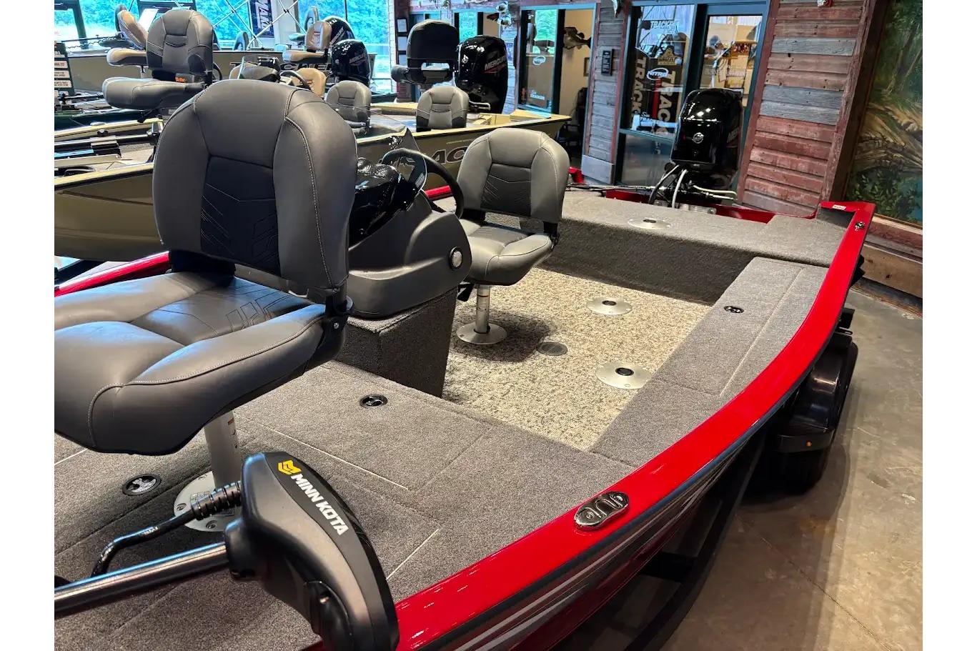 2026 Tracker Super Guide V-16 SC boat with gray seating and Minn Kota trolling motor.