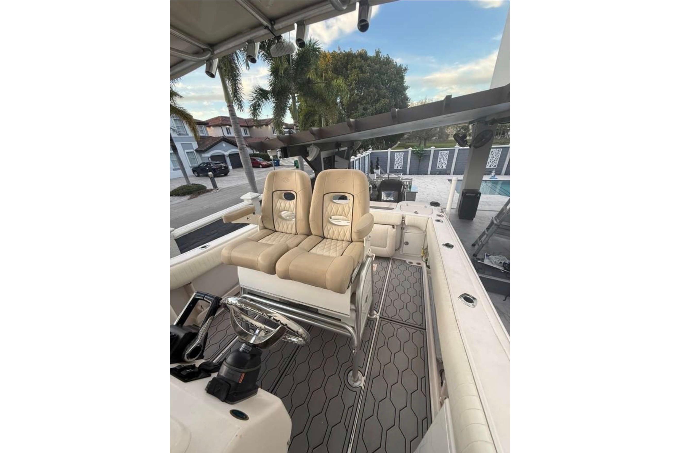 2004 Grady-White Chase 273 boat interior with dual seats and steering wheel.