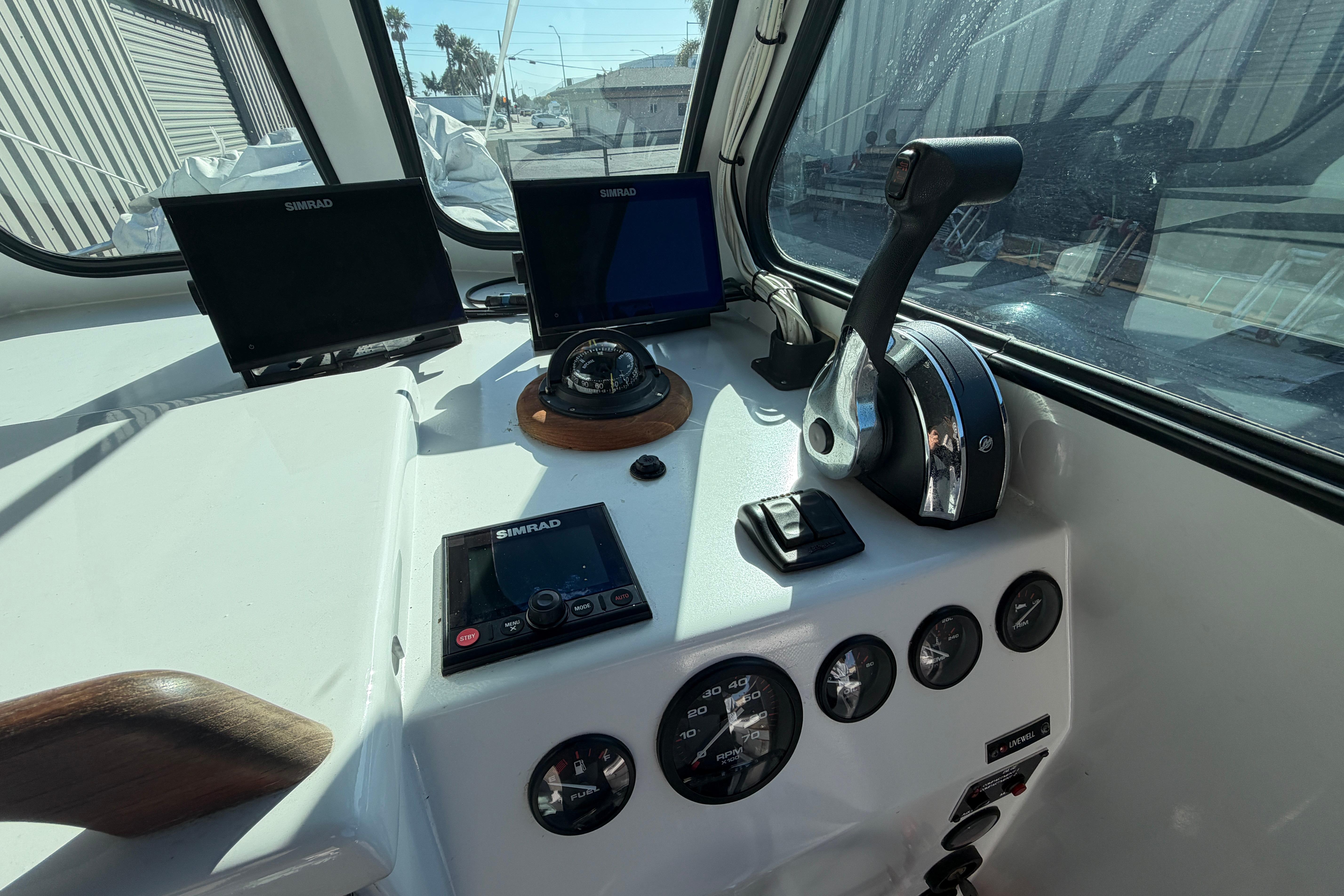 Control panel of a 1986 Radon 21 Sport boat with navigation equipment.