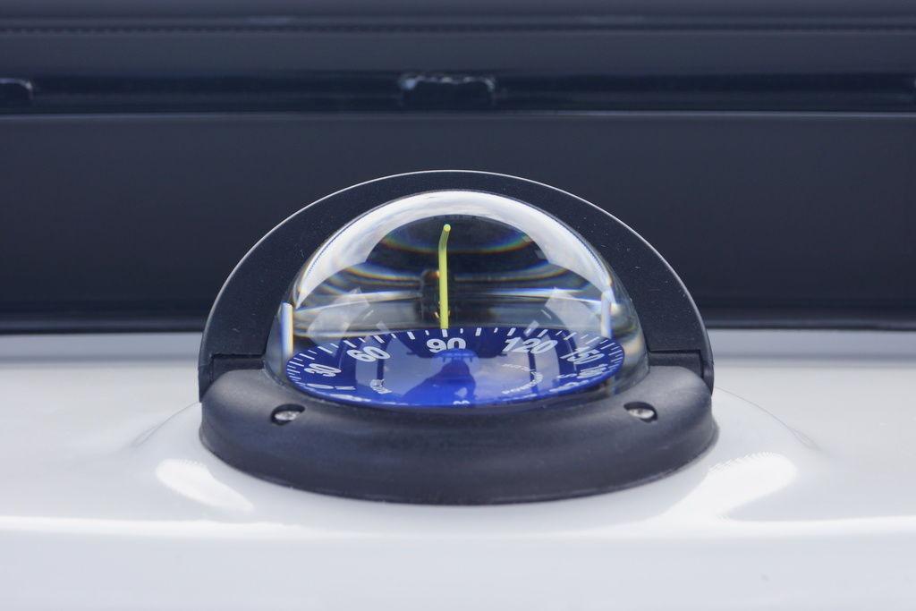 Compass on 2027 Tidewater 2500 Carolina Bay boat dashboard, close-up view.