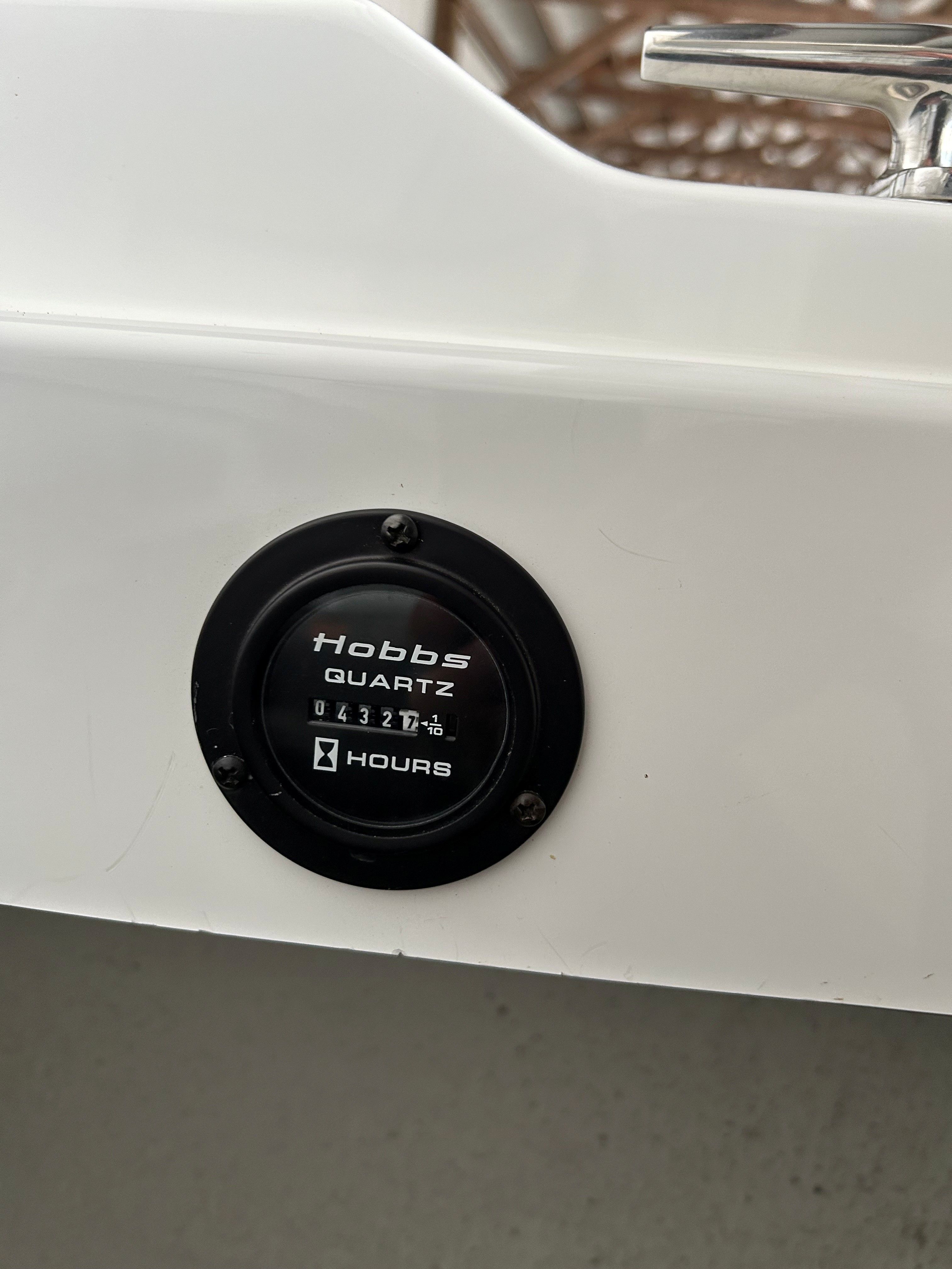 Close-up of an hour meter on a boat.
