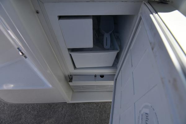 Open storage compartment on 2010 Cruisers Yachts 390 Sports Coupe.