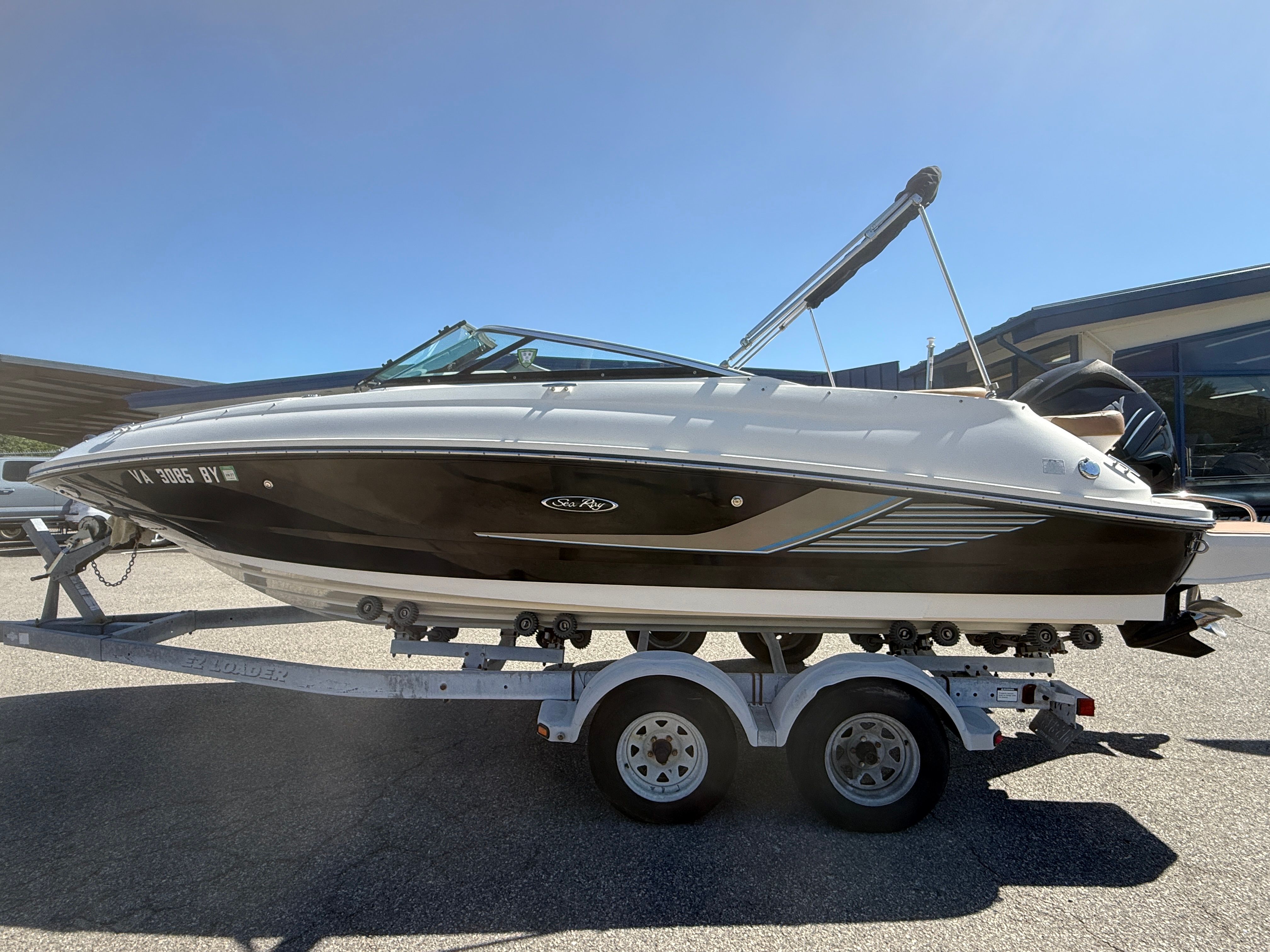 2015 Sea Ray 220 Sundeck OB on trailer, side view.