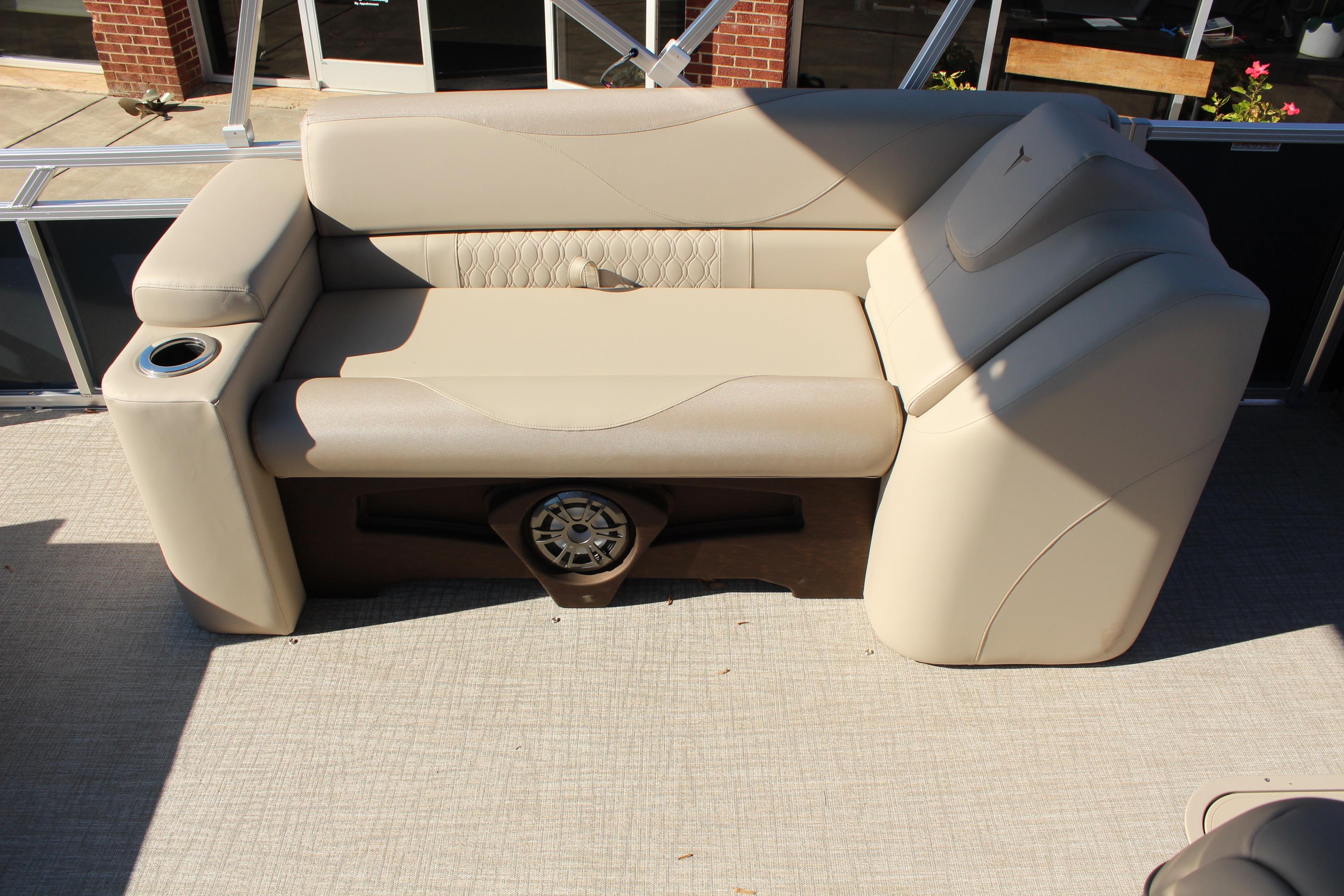 Luxurious seating on 2026 Tahoe Pontoon LTZ Elite with integrated speaker and cup holder.