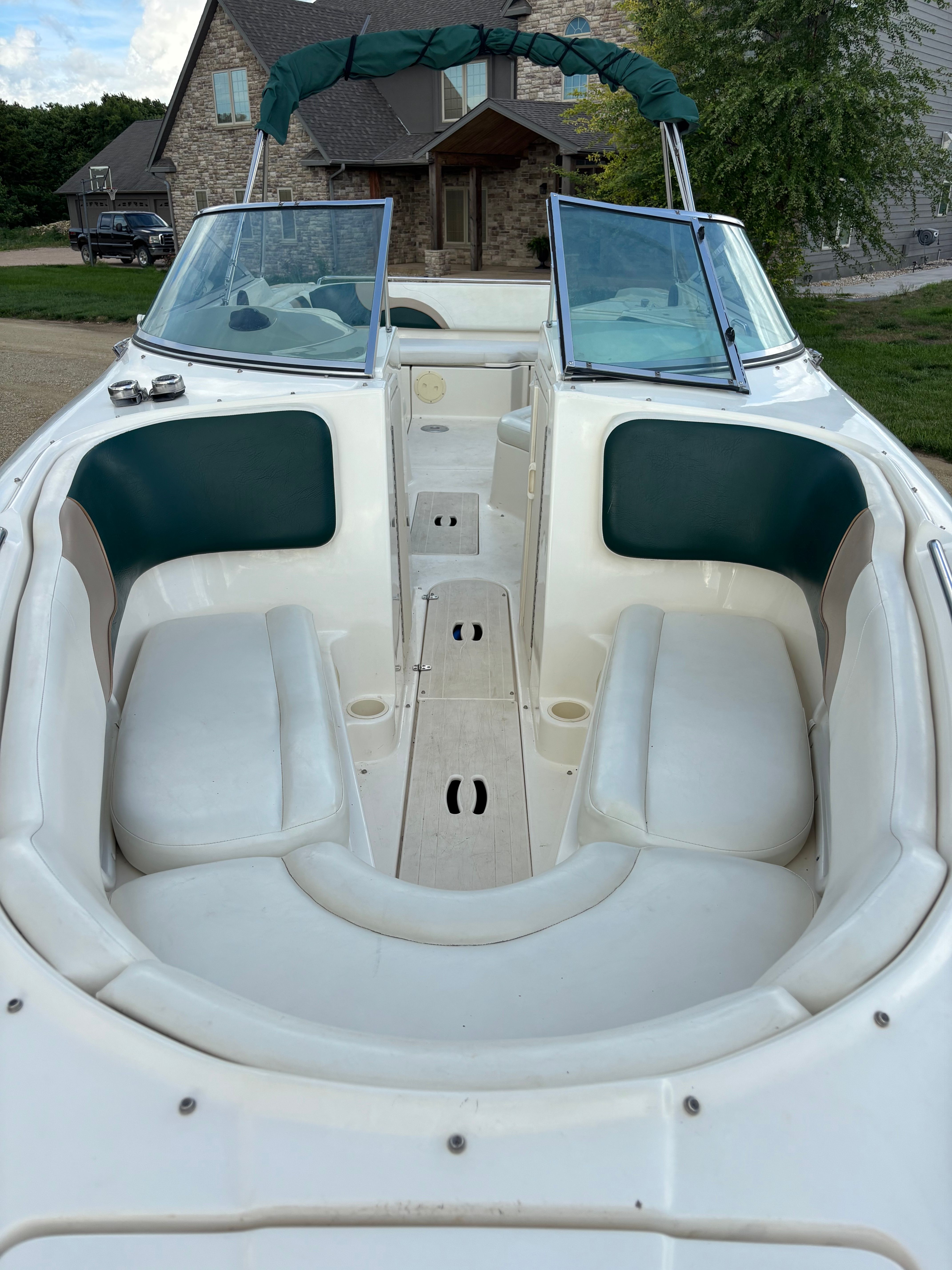 Interior view of a 1999 Rinker Captiva 272 boat with seating area.