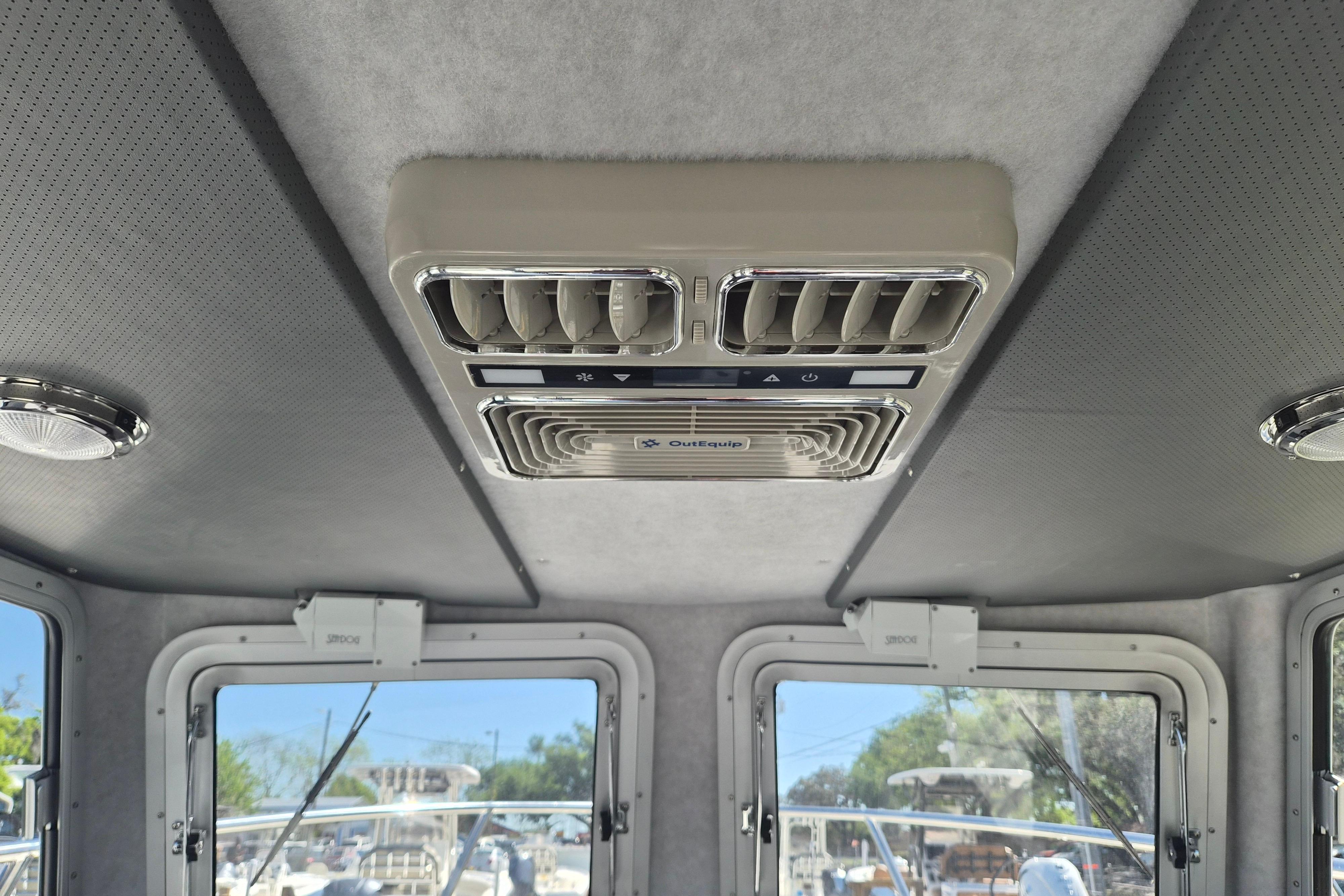 Ceiling view of 2026 Defiance Admiral 220 EX boat cabin with air conditioning unit.