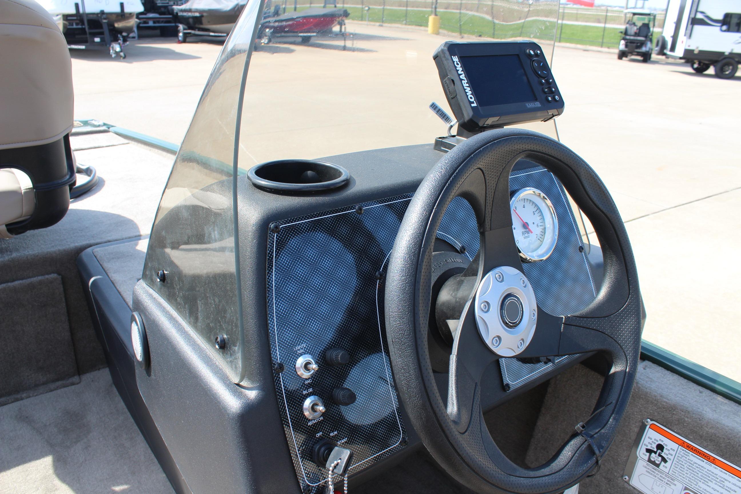 Steering console of 2026 Tracker Bass Tracker Classic Limited boat with navigation display.