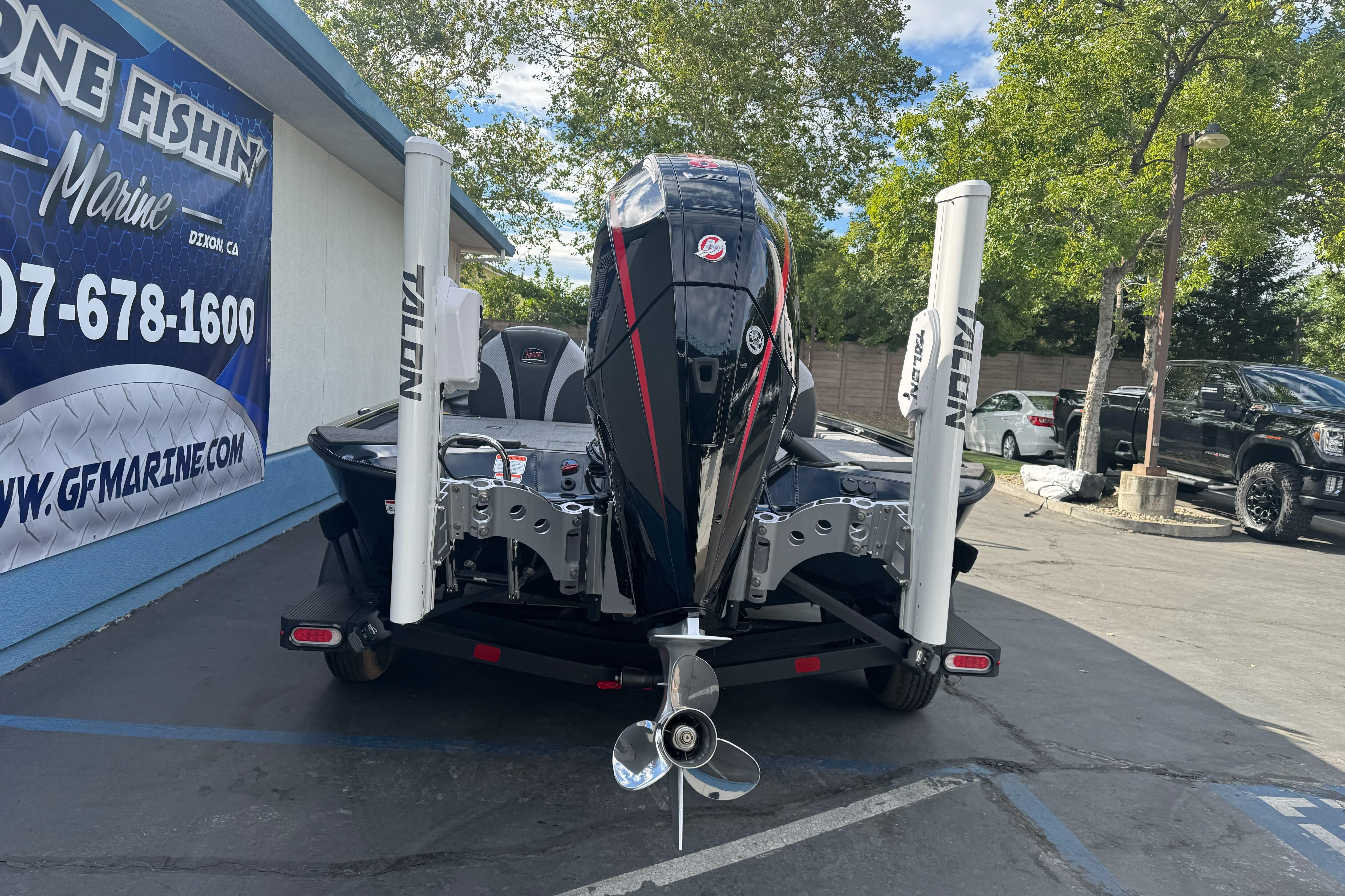 2026 Ranger ALPHA 208 boat with powerful motor, parked at marine dealership.