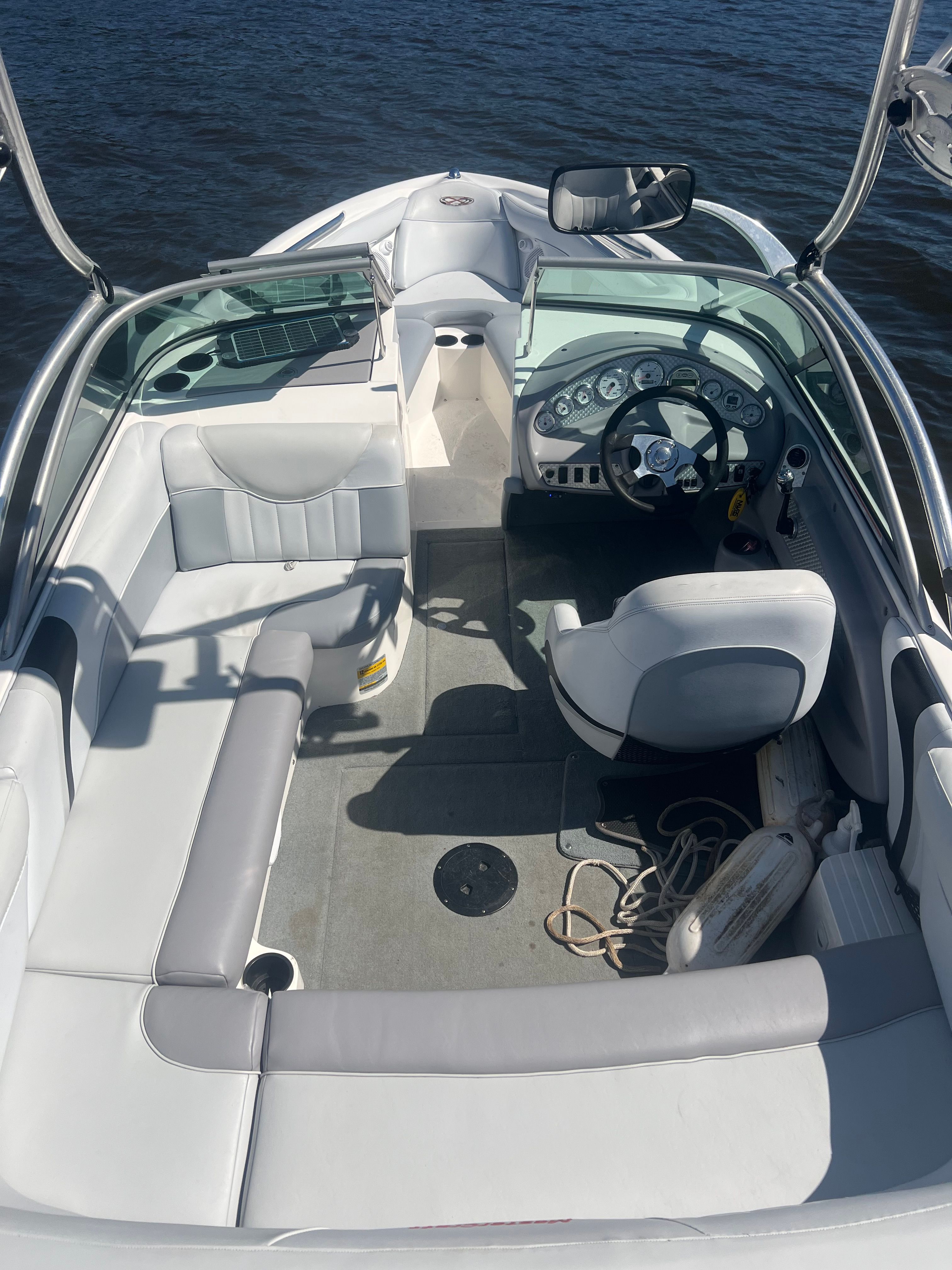 Interior view of a 2003 MasterCraft X2 boat with gray and white seating.