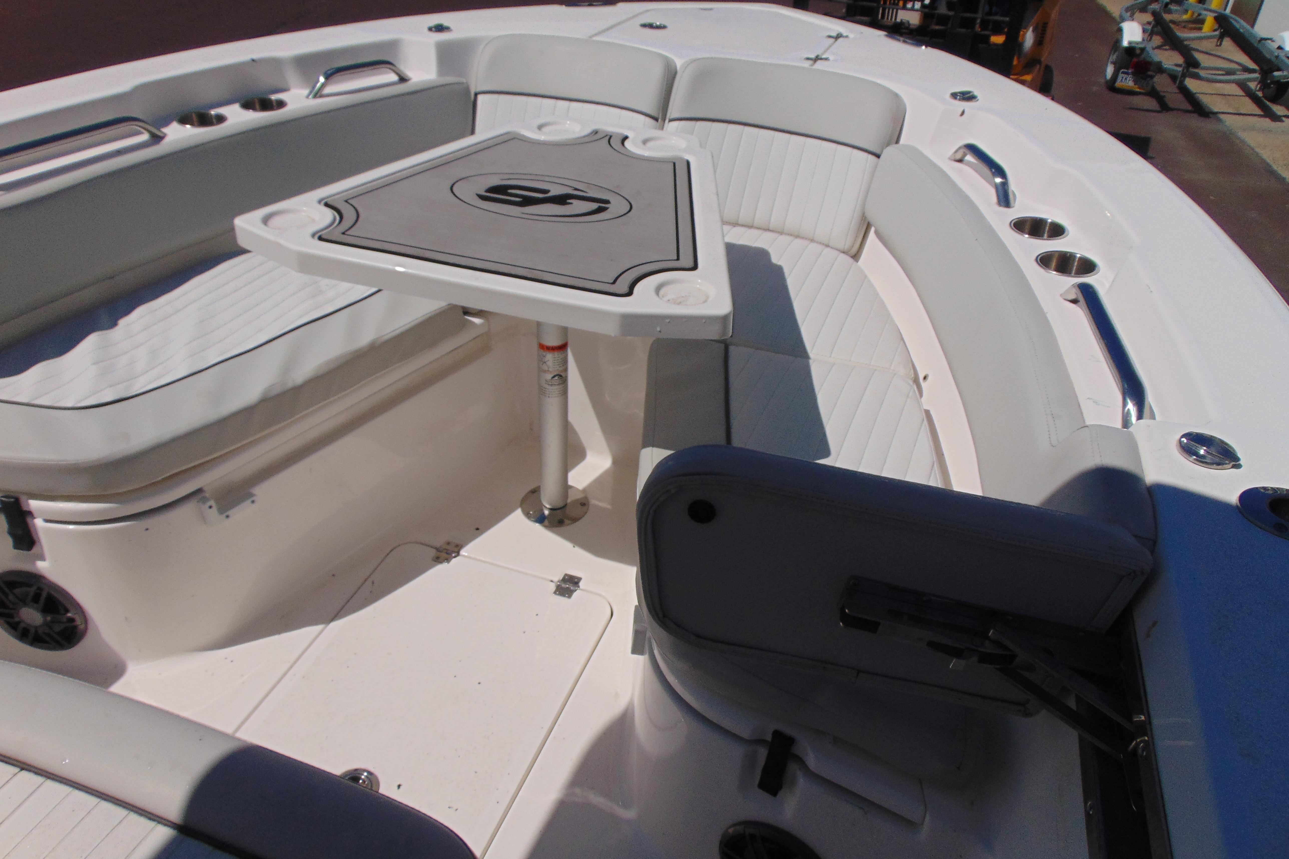 2022 Sea Fox 248 Commander boat interior with seating and table setup.