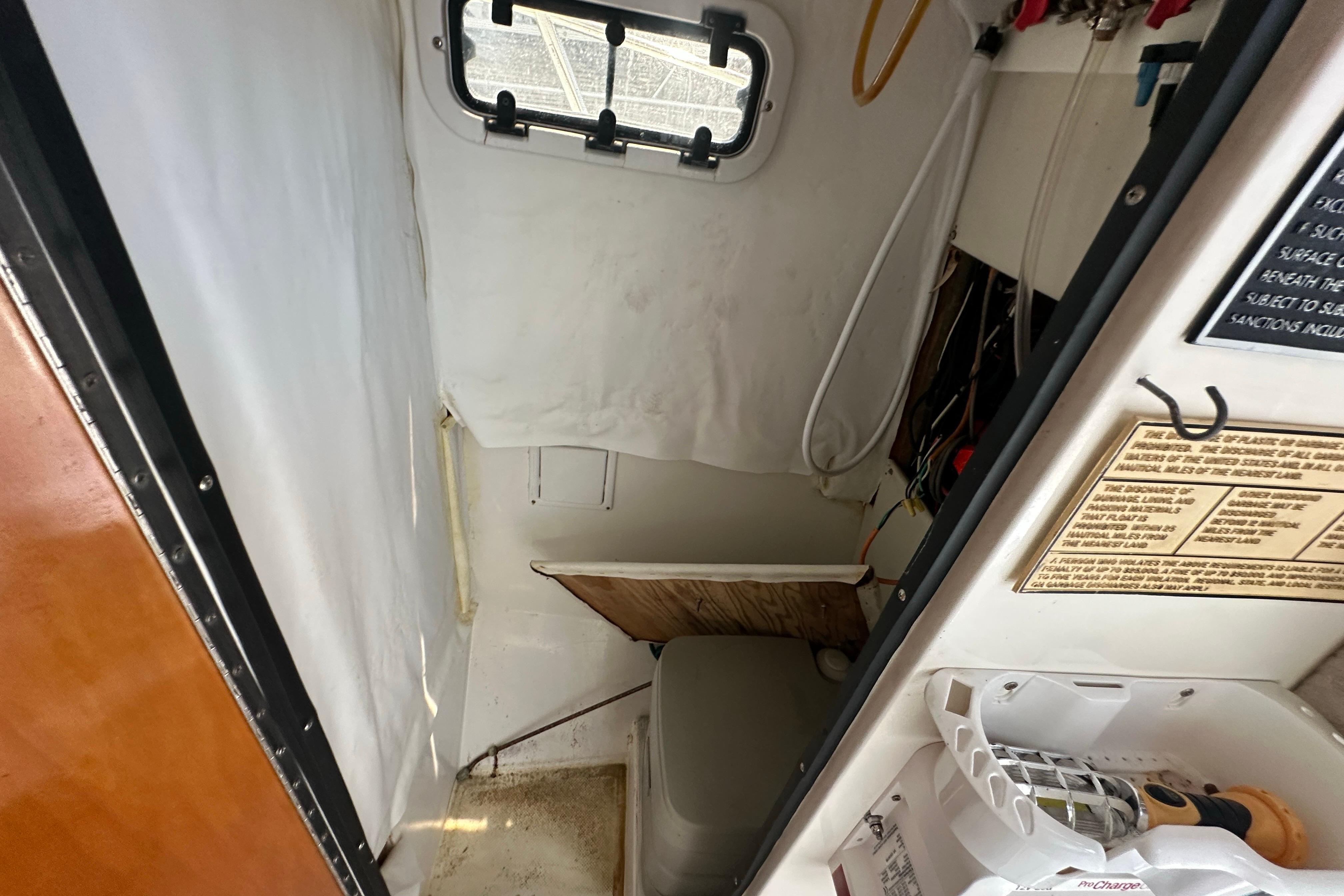 Interior of a 1998 True World Marine TE286 boat, featuring a compact cabin space.