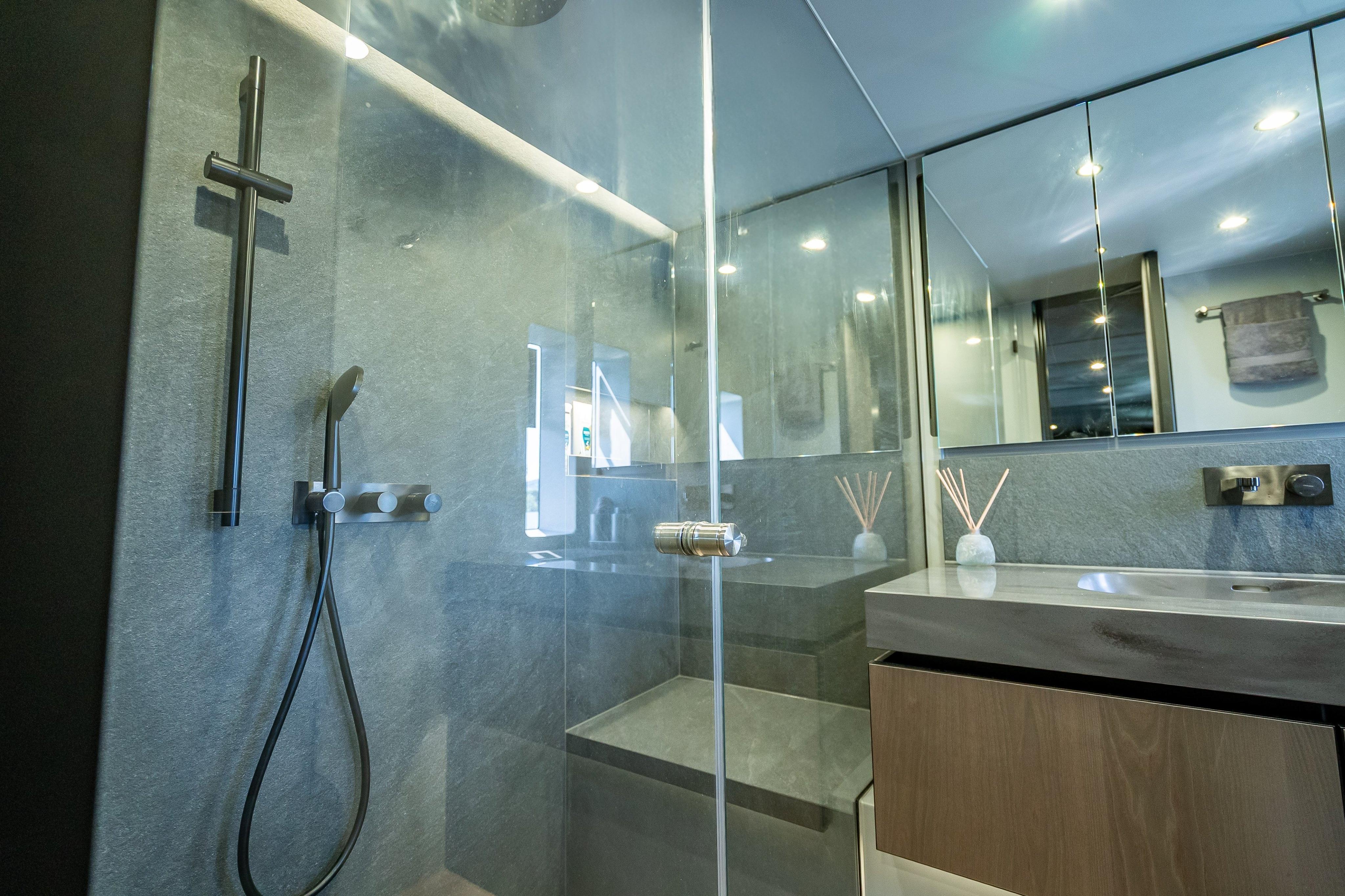 Luxurious bathroom in 2026 Sunreef 60 Power yacht with modern shower and sleek design.
