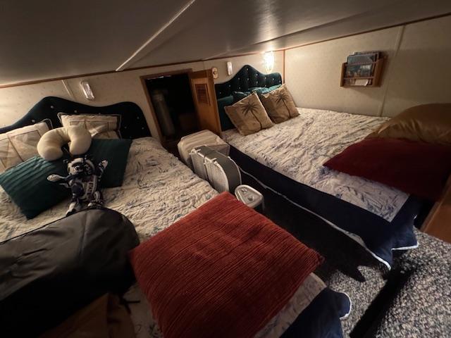 Cozy bedroom in 1994 Gibson 44 Standard boat with twin beds and plush pillows.