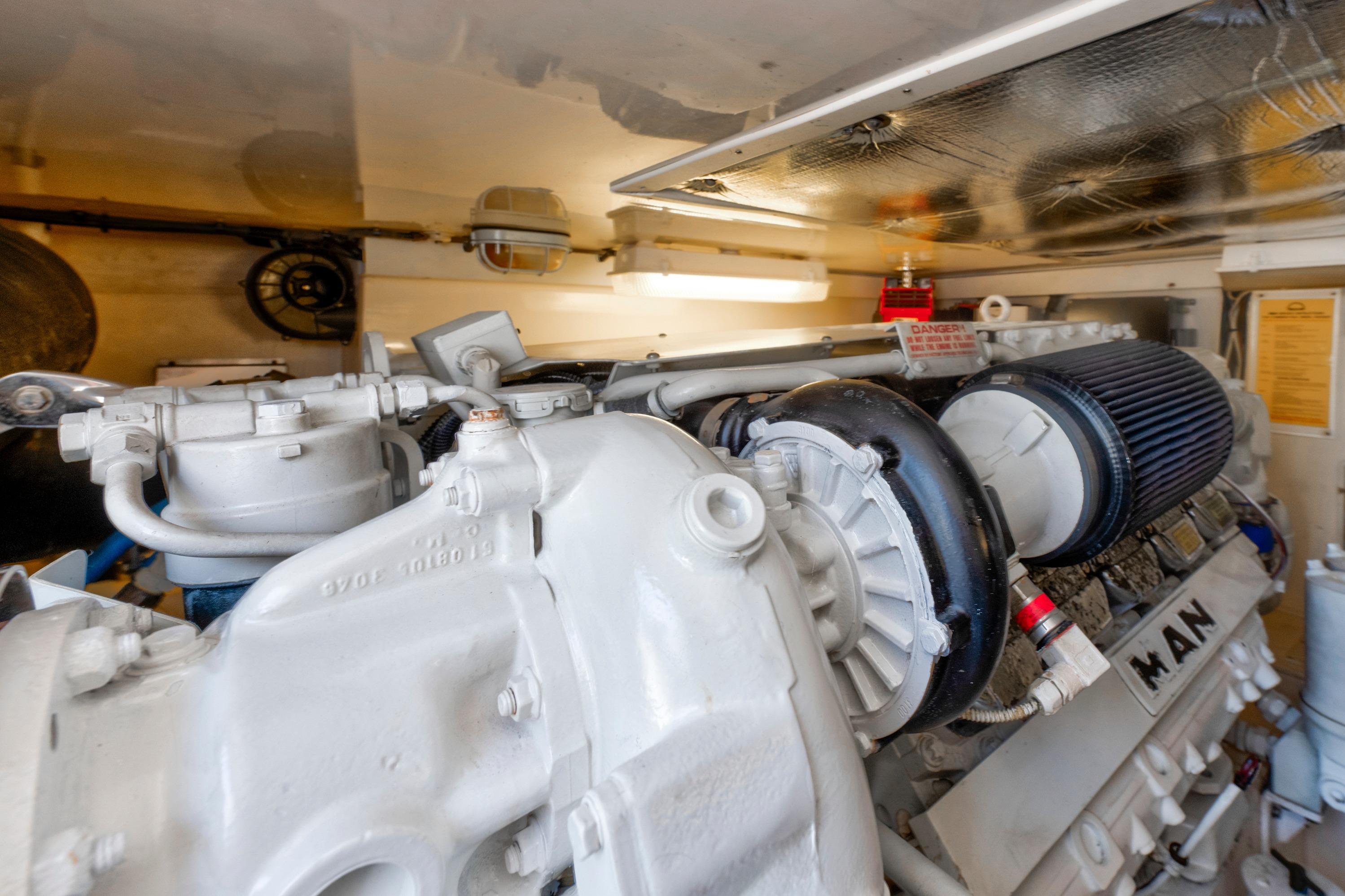 Engine room of 2010 Cabo 45 Express yacht, featuring a MAN engine.
