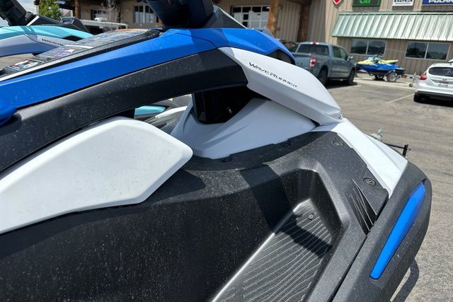 Close-up of a Yamaha WaveRunner Jetblaster in black and blue on a parking lot.
