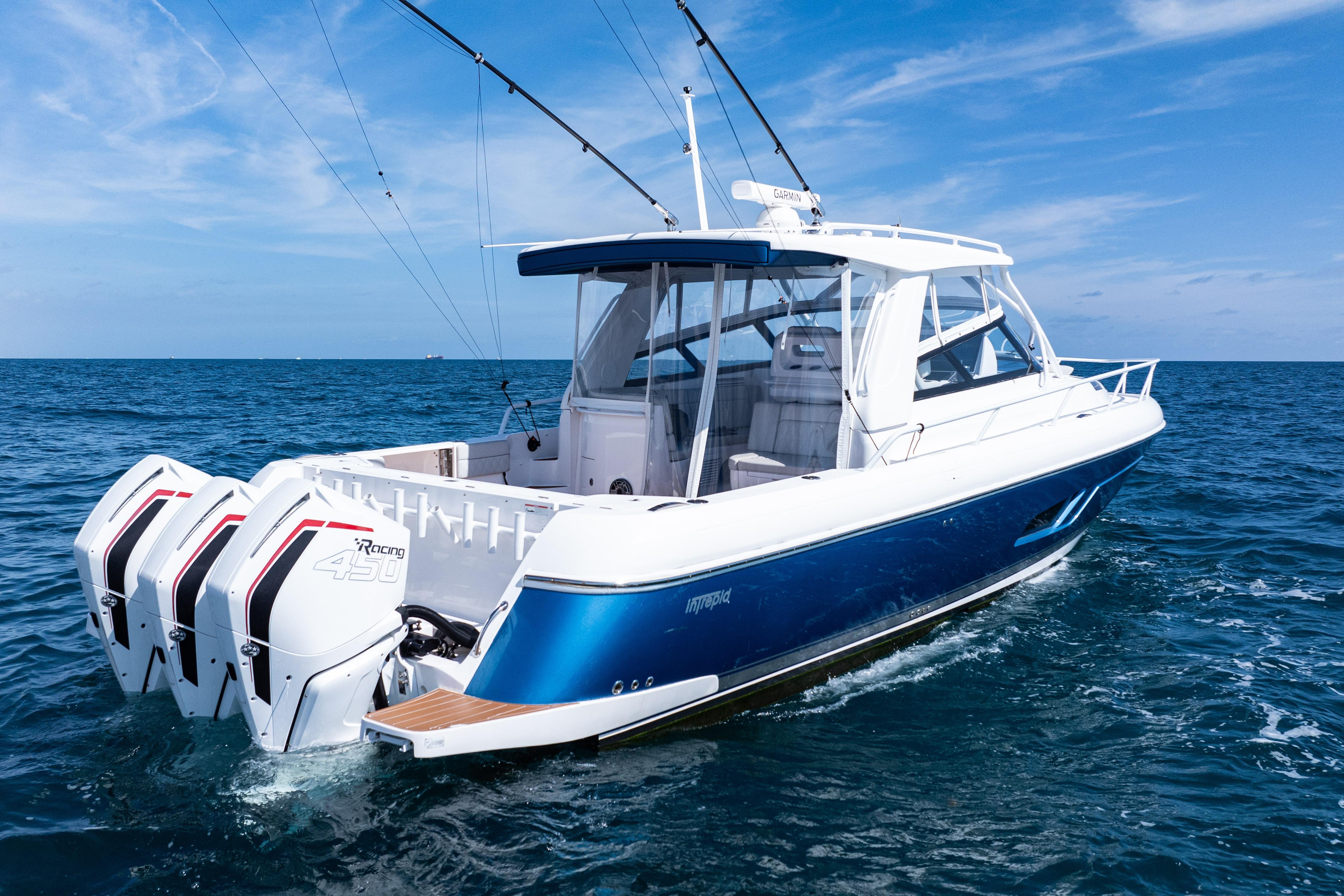 2018 Intrepid 438 Evolution boat cruising on open sea with clear blue skies.