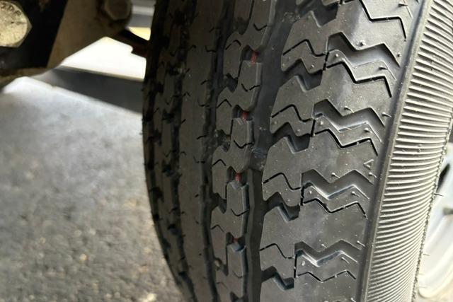 Close-up of a 2017 Searay SPX210 tire with detailed tread pattern.