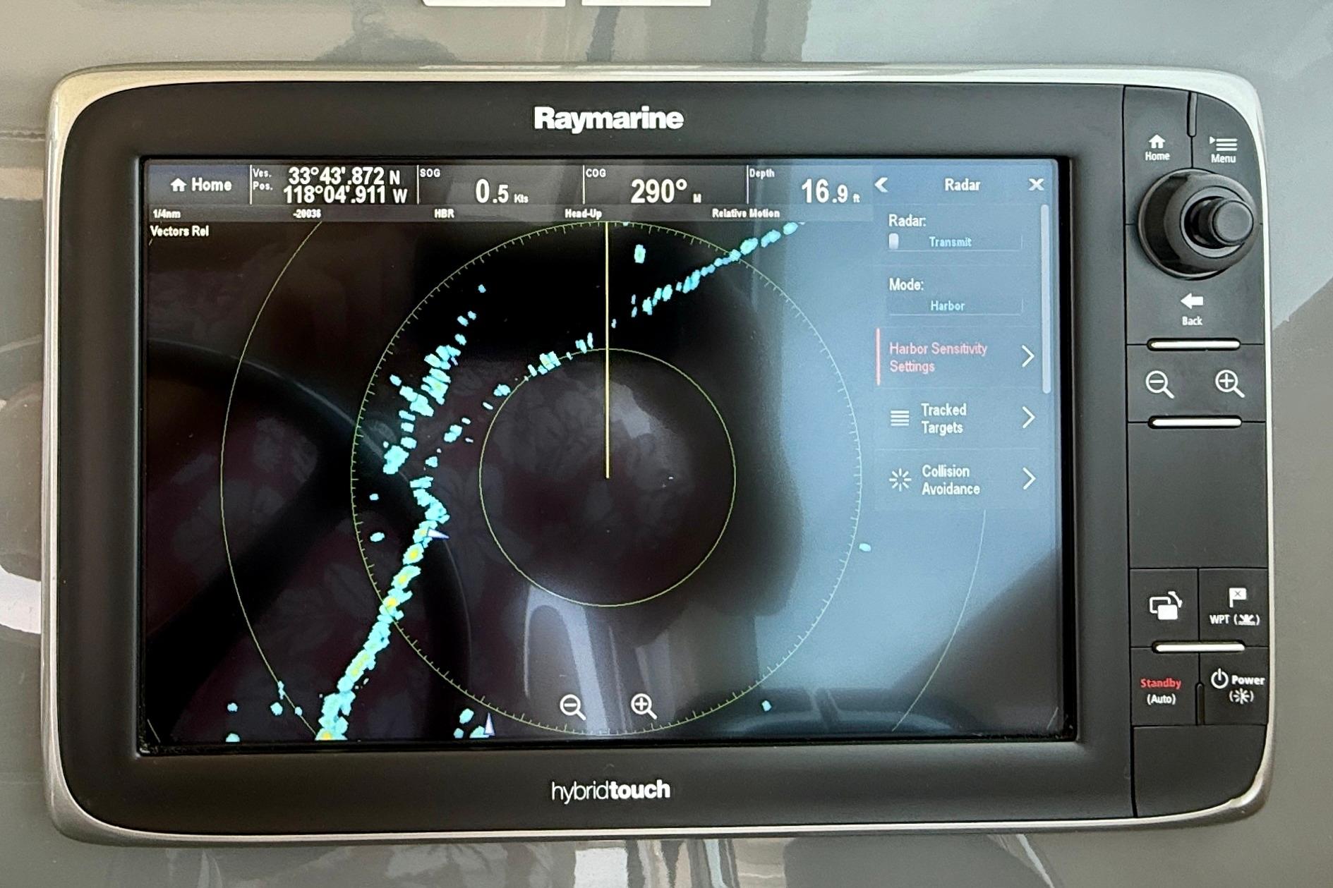 Raymarine radar display on 2012 Pursuit OS 345 Offshore boat, showing navigation data.