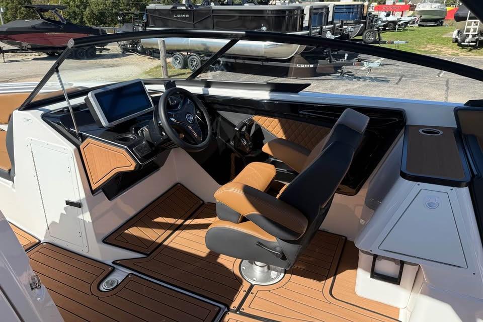 2026 Yamaha Boats 252SD interior with modern dashboard and luxurious seating.