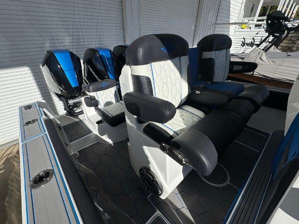 2024 Fountain 34 SC boat interior with modern seating and dual outboard motors.
