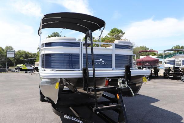 2024 Bennington 21 SSR pontoon boat on a trailer in a dealership lot.