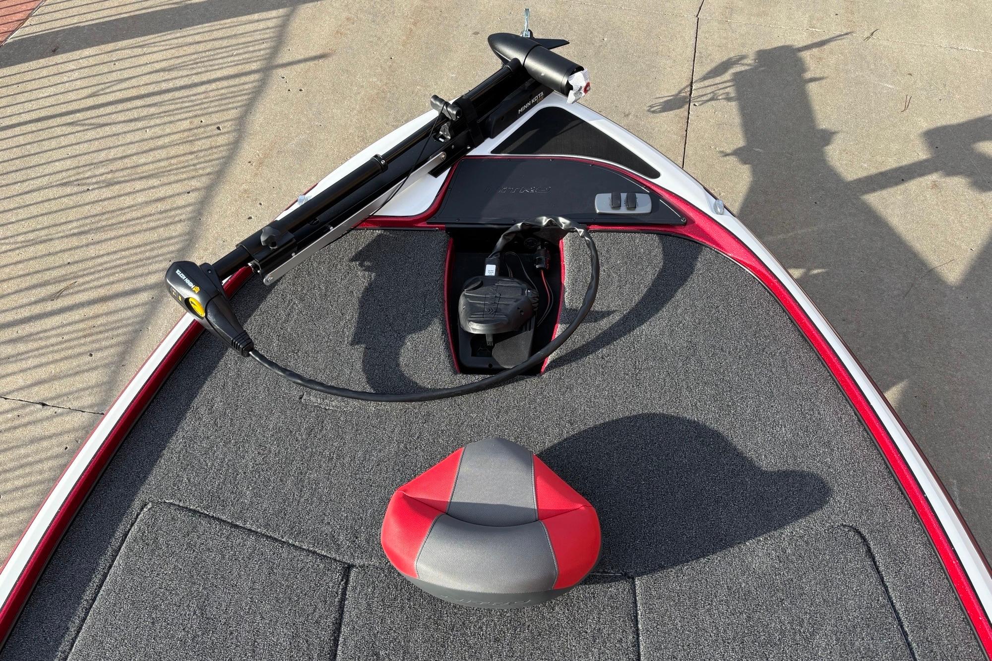 2026 Nitro Z17 boat deck with trolling motor and red-gray seat.