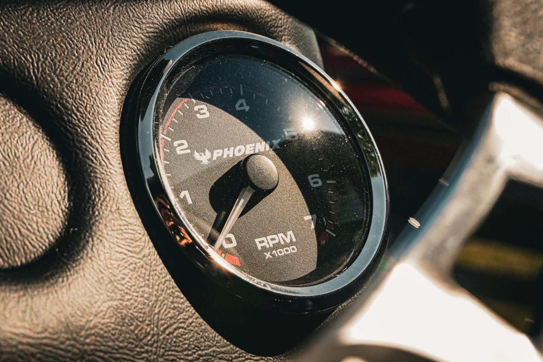 Close-up of 2026 Phoenix 721 ZXL tachometer, displaying RPM gauge in sunlight.