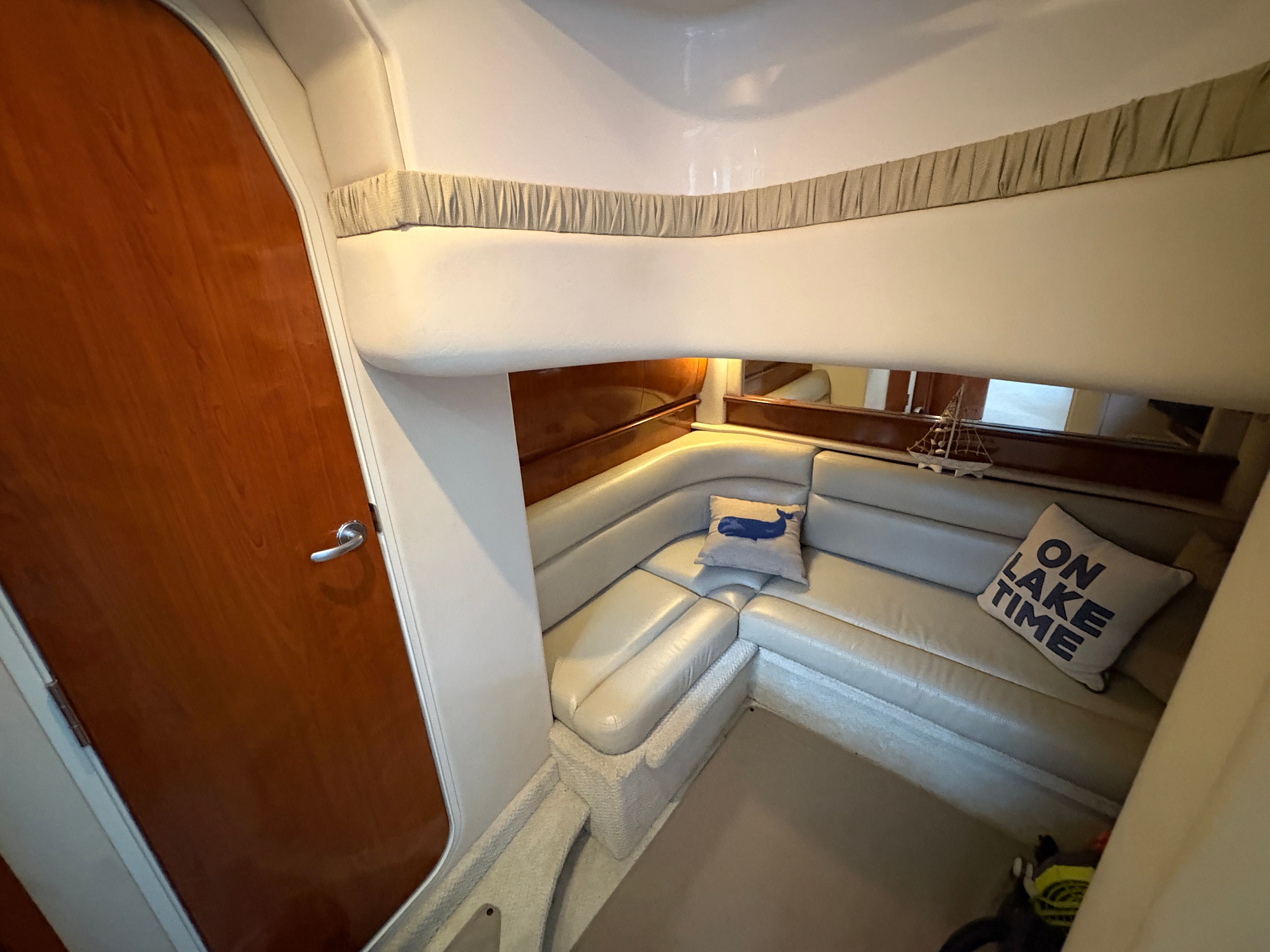 Interior of a 2005 Sea Ray 420 Sundancer yacht with cozy seating area.