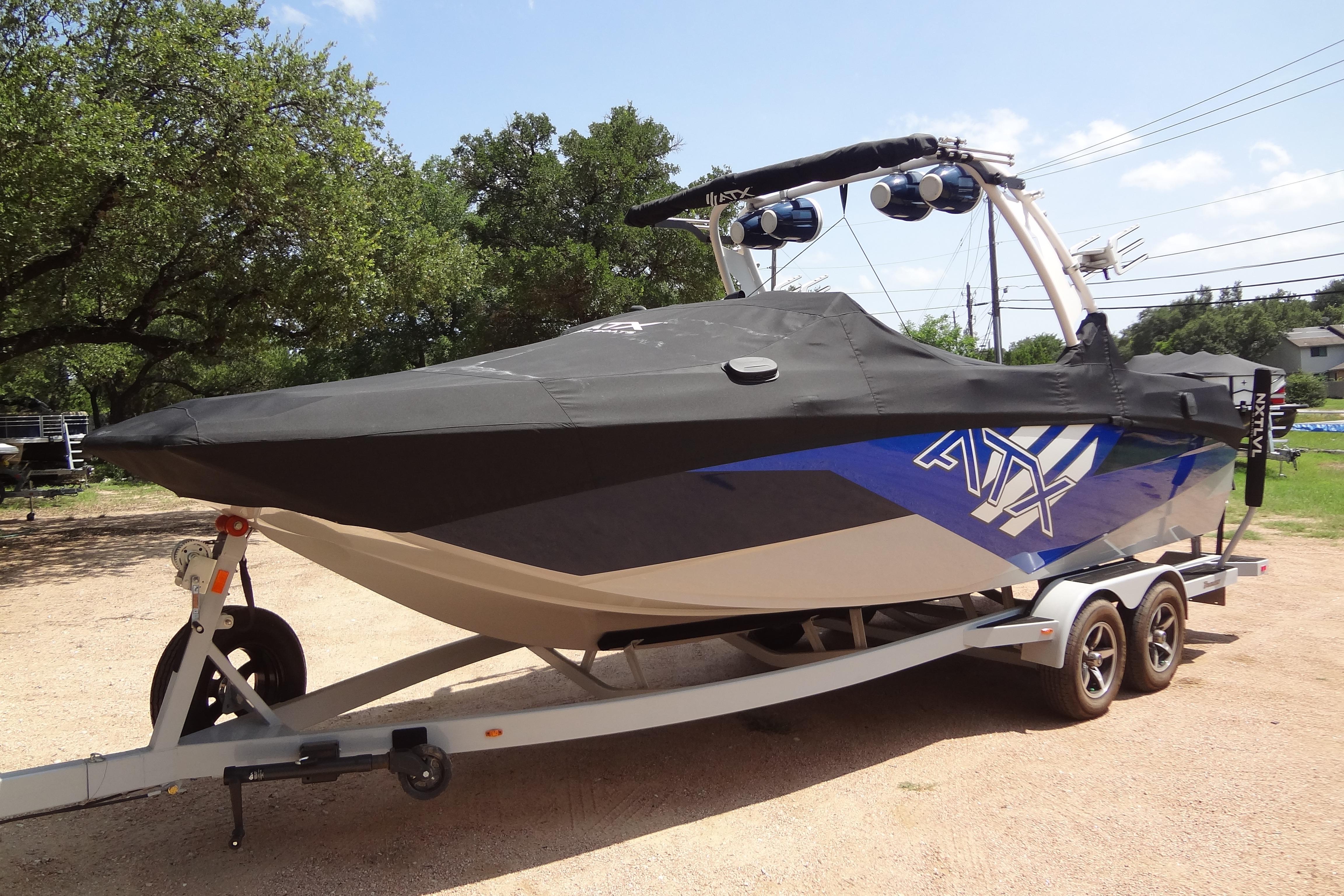 2022 ATX Surf Boats 24 Type-S on trailer, covered, outdoors.