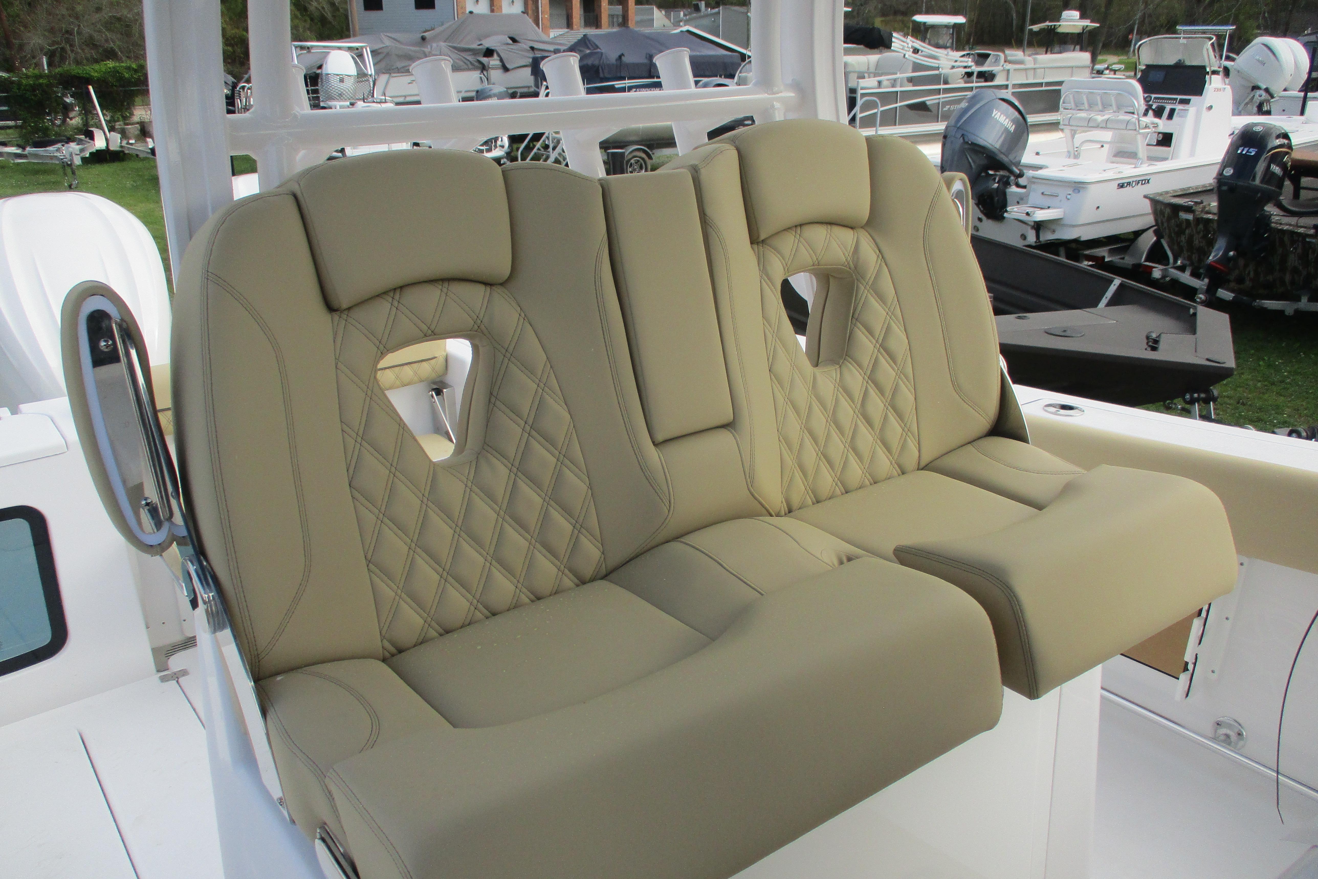 Luxurious seating on 2026 Sportsman Open 302 Center Console boat, featuring diamond-stitched upholstery.