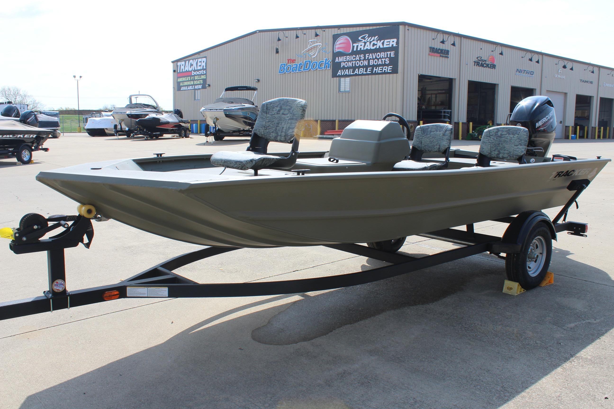 2026 Tracker Grizzly 1754 SC boat on trailer outside dealership.