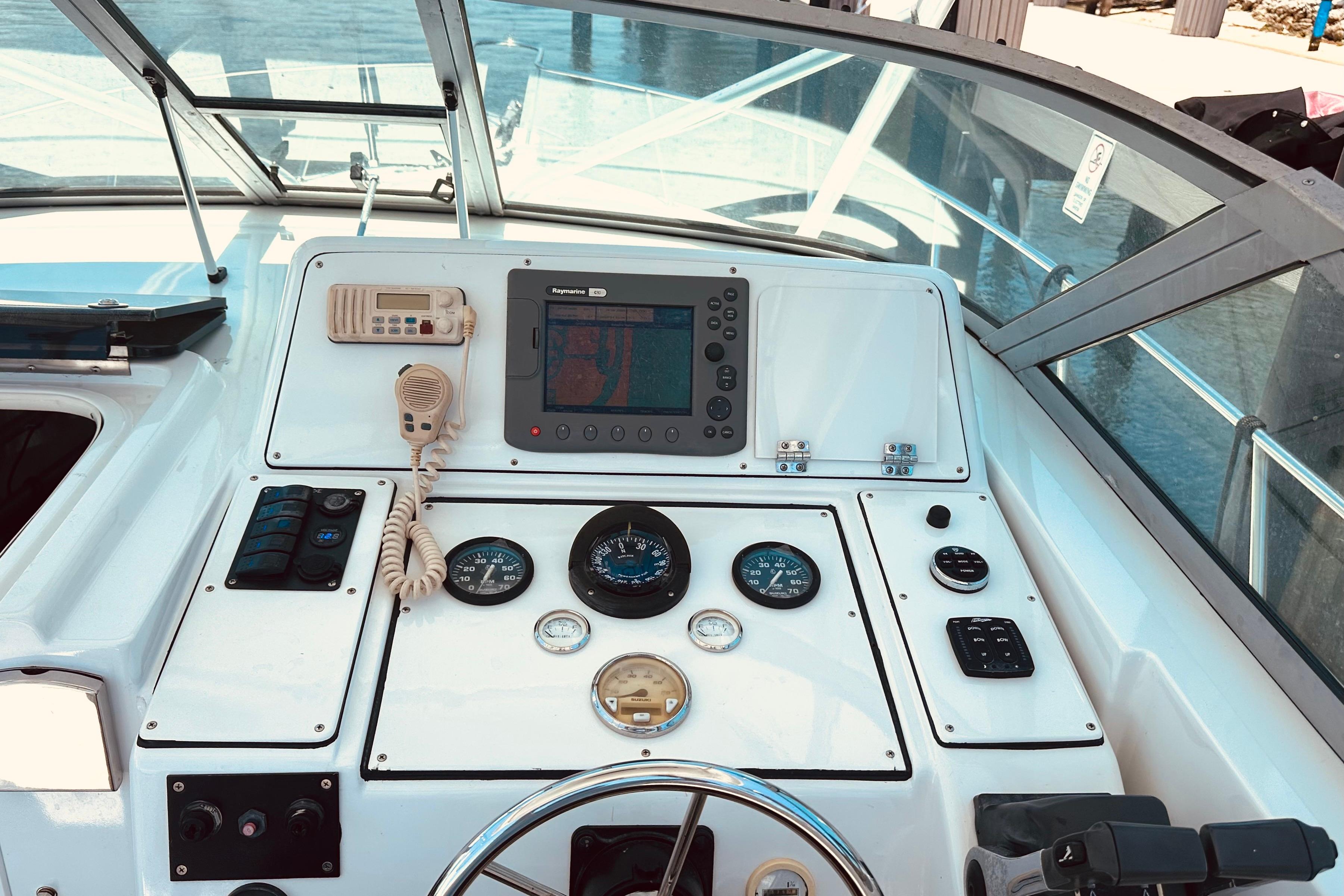1994 Pro-Line 2950 Walkaround boat dashboard with navigation equipment and controls.