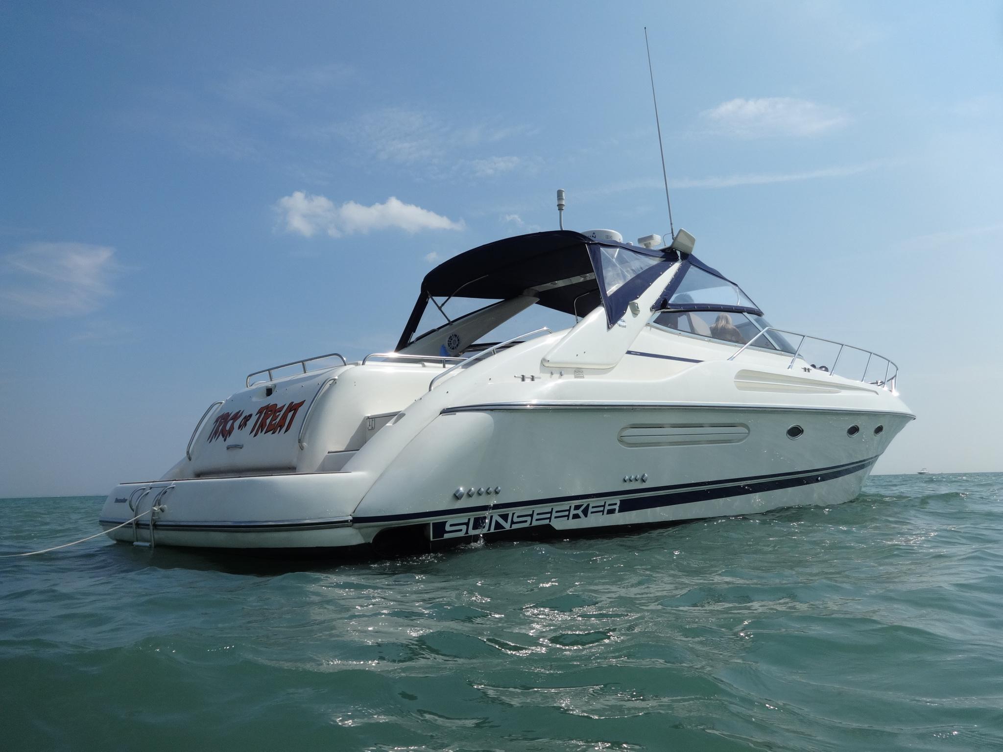 1997 Sunseeker Camargue 47 yacht on open water under clear sky.
