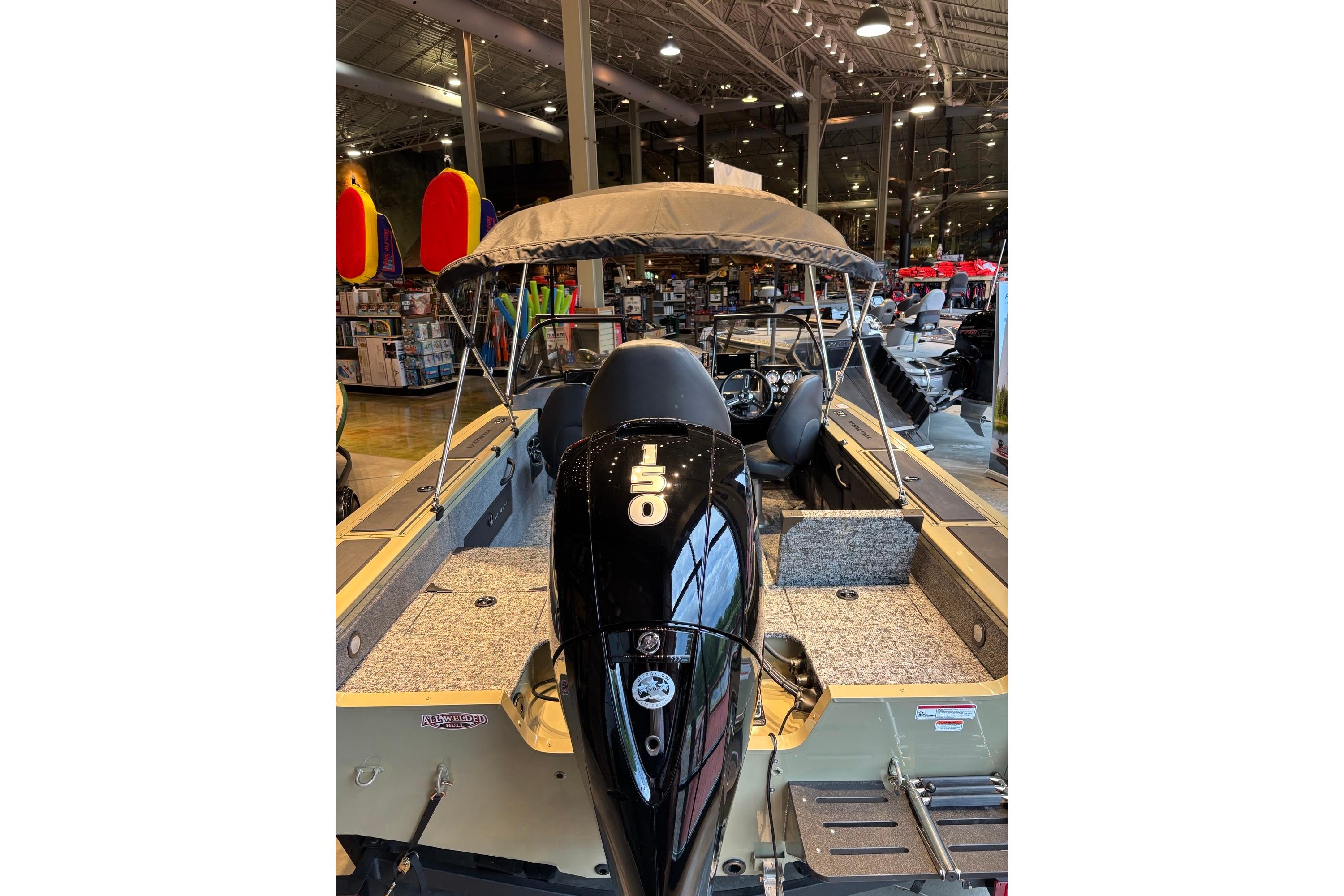 2026 Tracker Targa V-18 Combo boat with 150 HP engine displayed indoors.