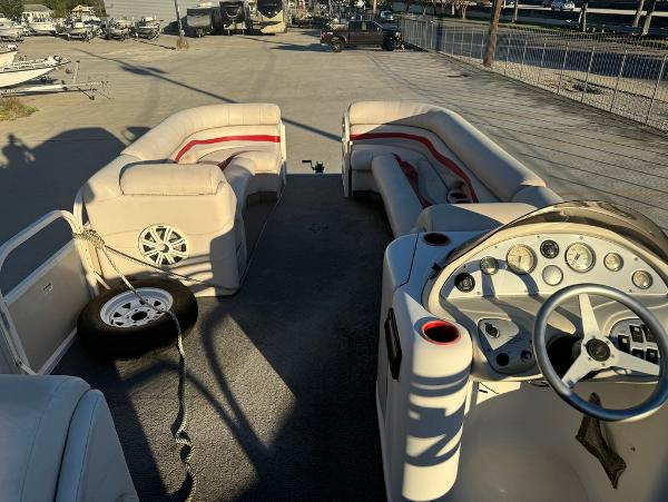 2005 Starcraft 22 Sport boat interior with seating and steering console.