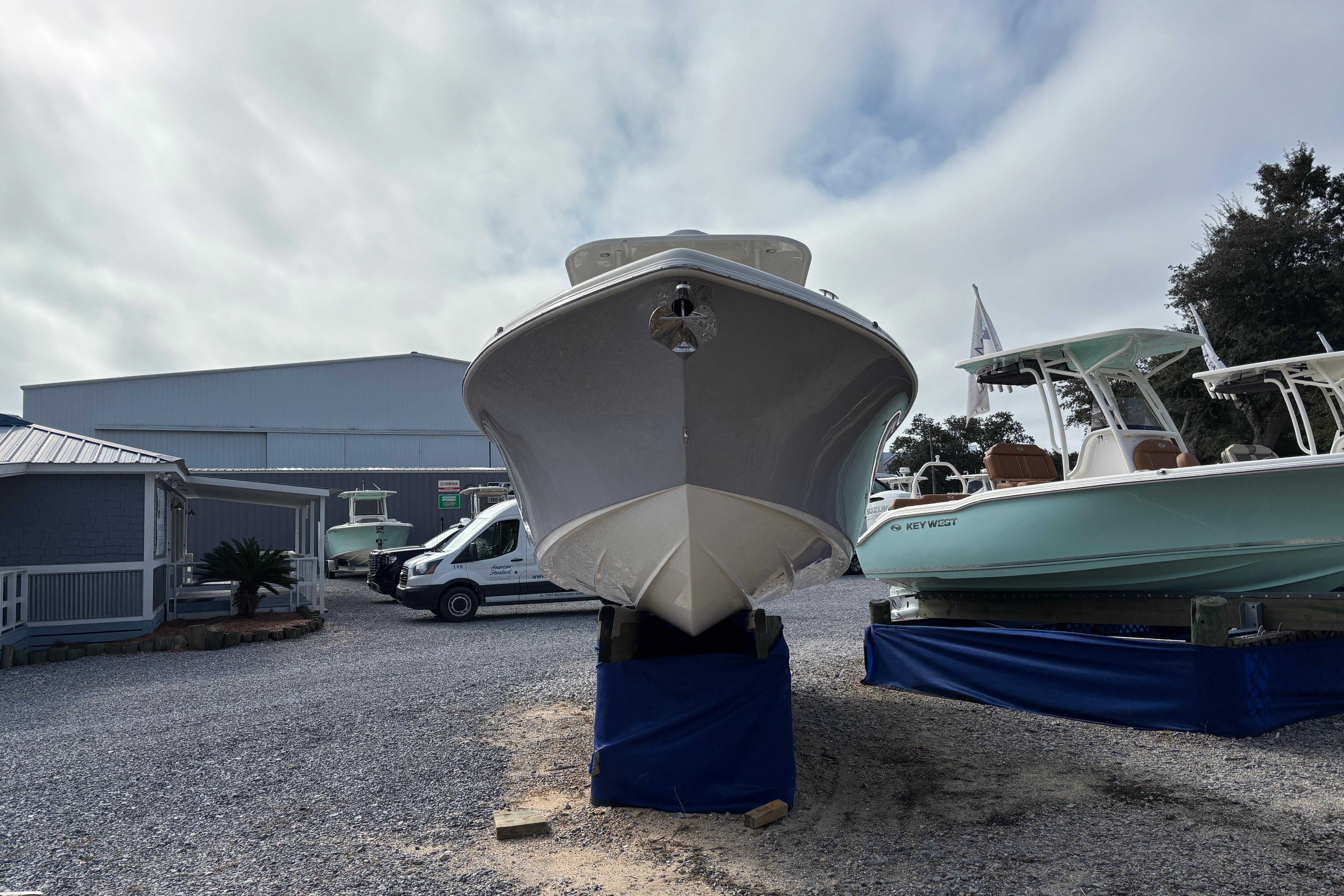 2026 Key West 263 FS boat displayed outdoors on a gravel lot.