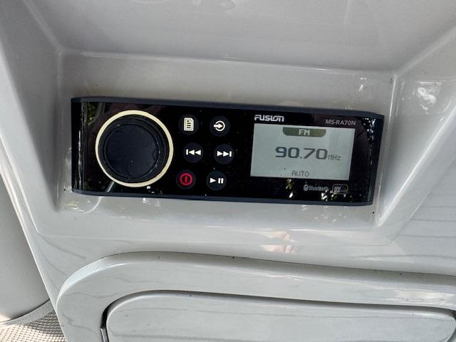 Radio control panel on 2017 Crest Caribbean 250 L boat, displaying FM 90.70 Hz.