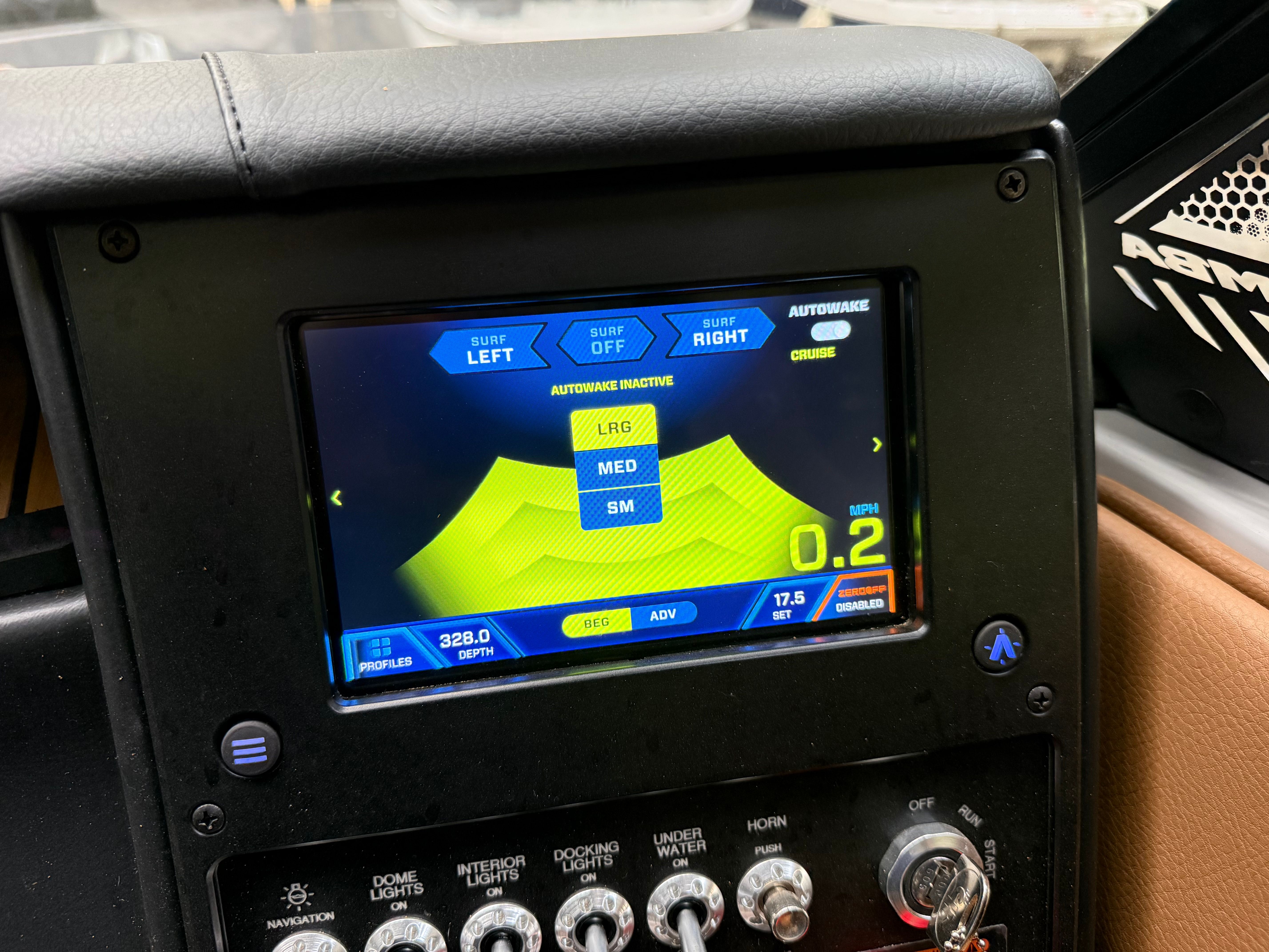 Dashboard of a 2025 Malibu Mojo with digital display and control knobs.